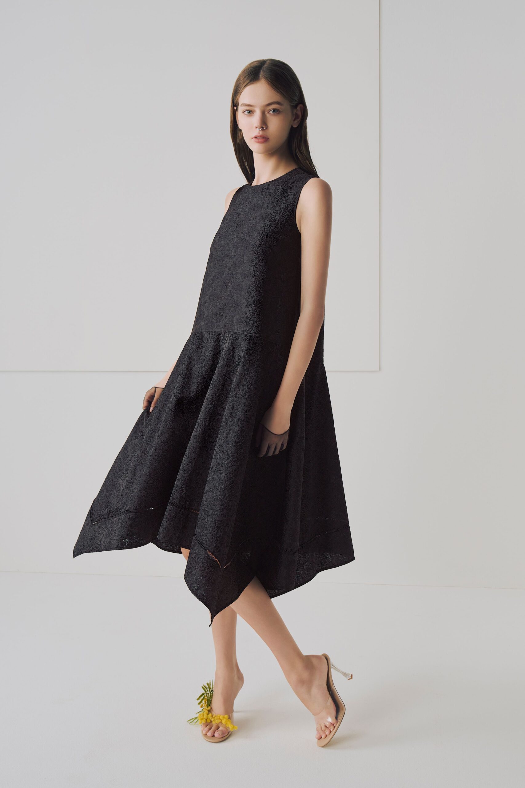 black silk sleeveless dress with clear shoes