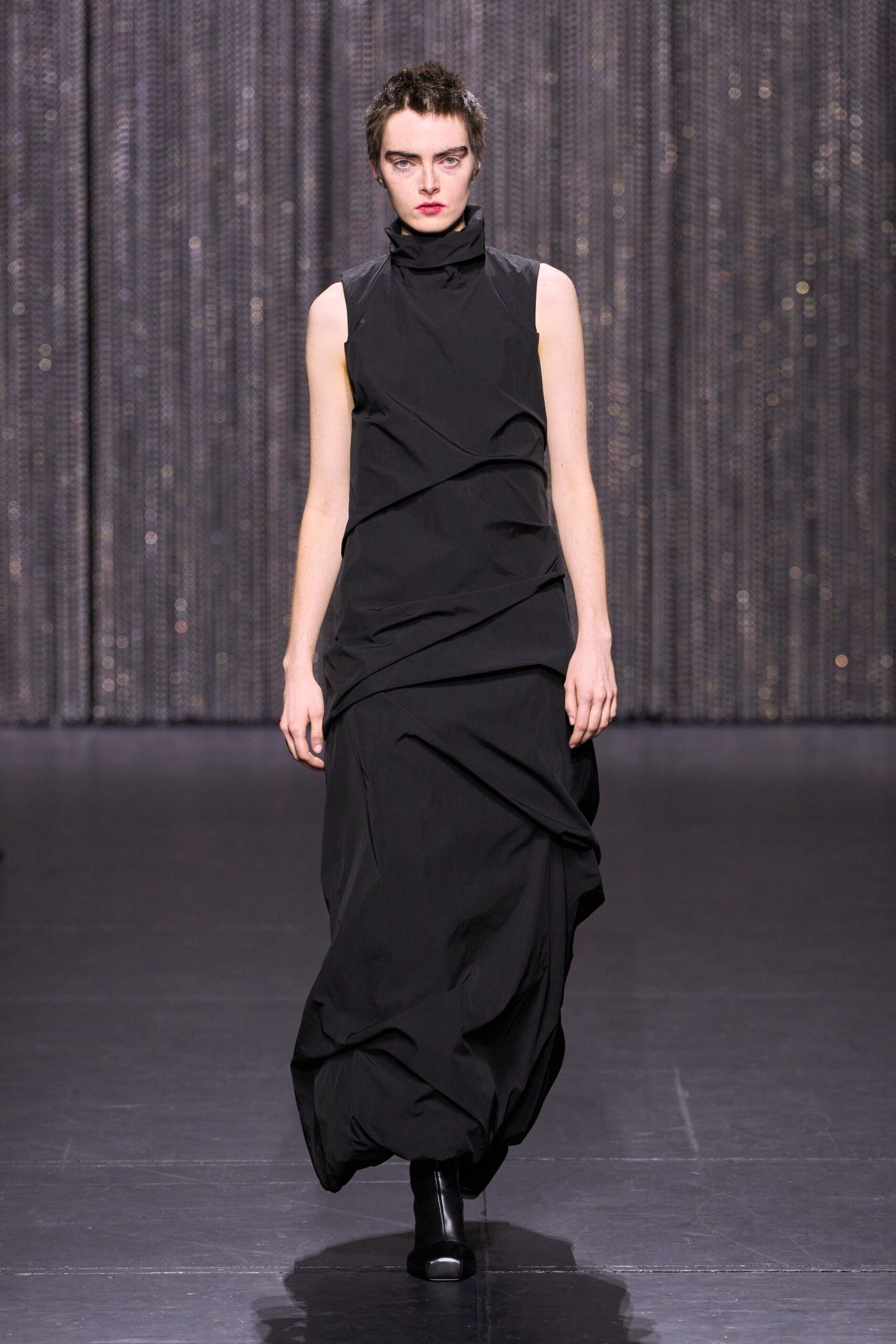 black fitted sleeveless gown with boots
