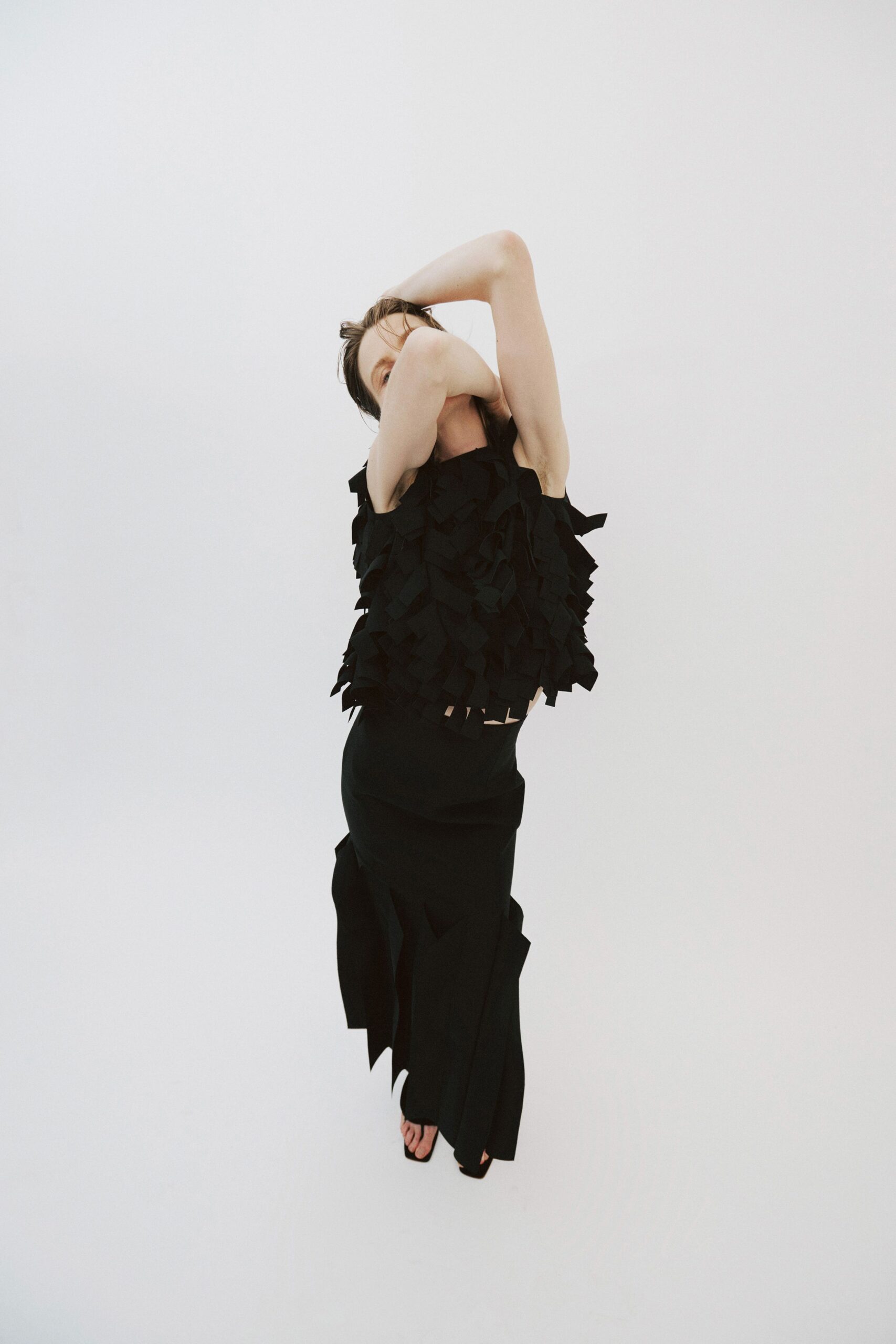 black ruffled top with asymmetric skirt