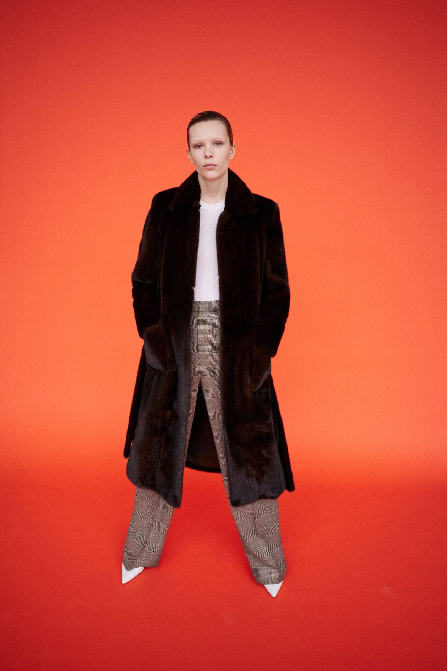 black fur coat white top gray pants white heels