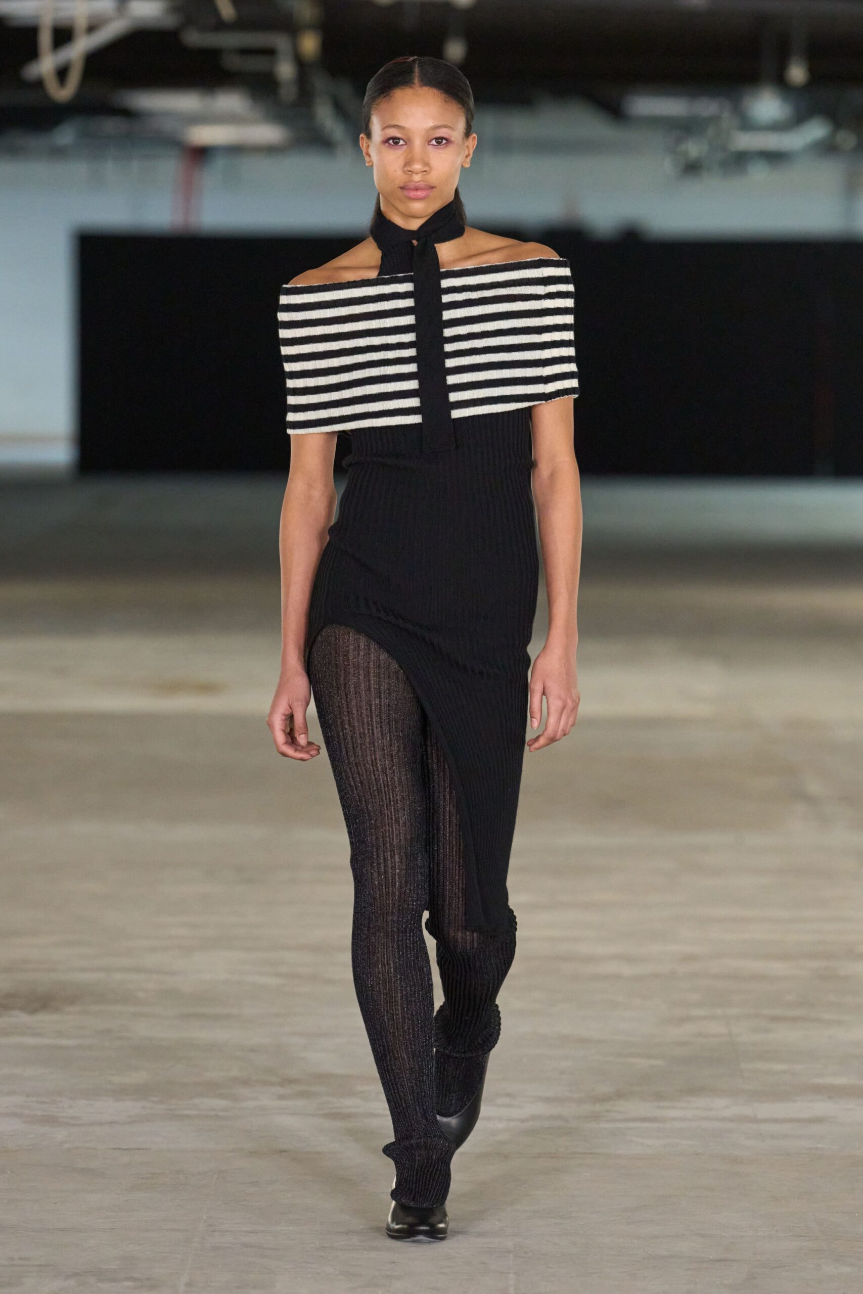 black and white striped top with fitted pants
