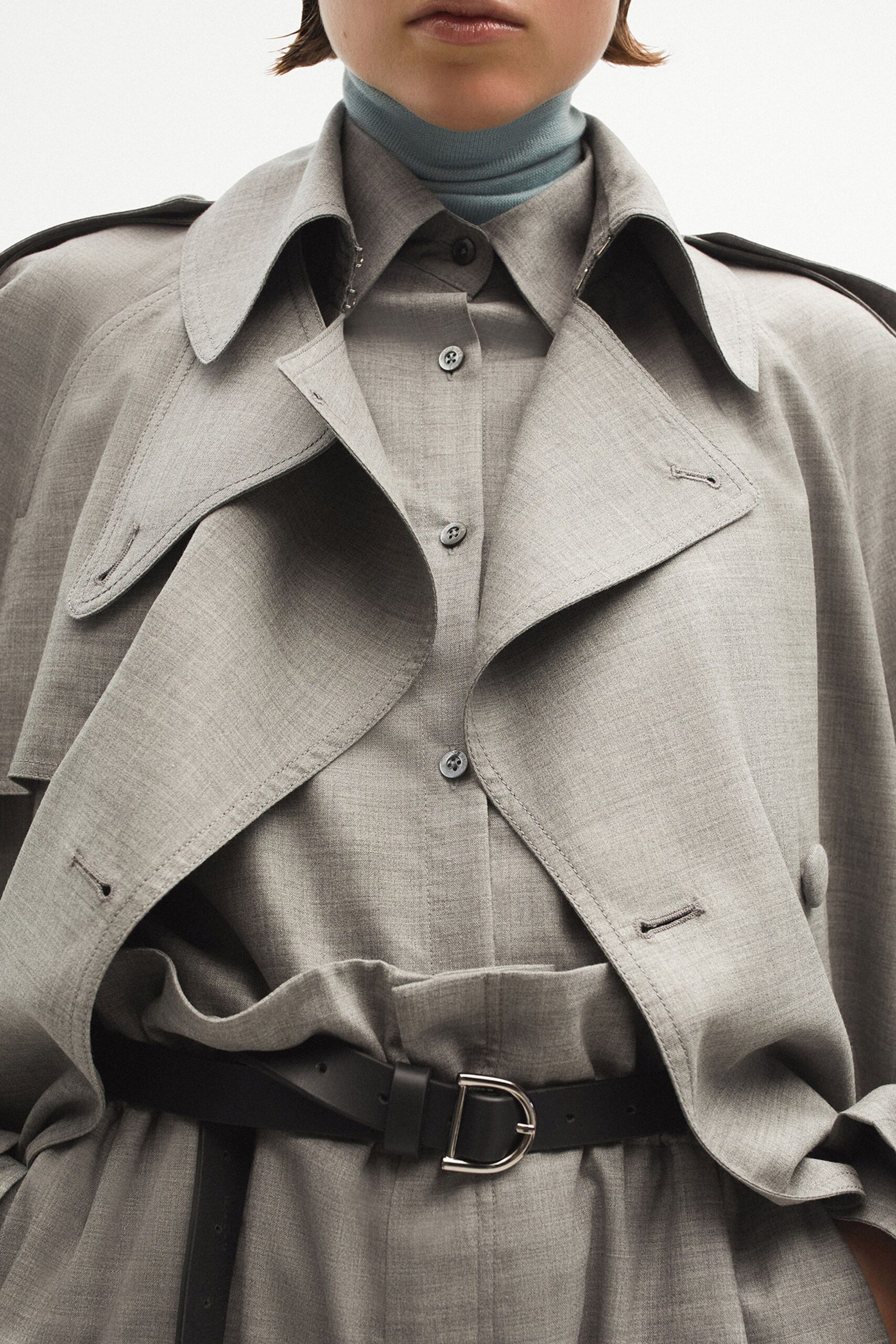 gray coat and shirt with black belt