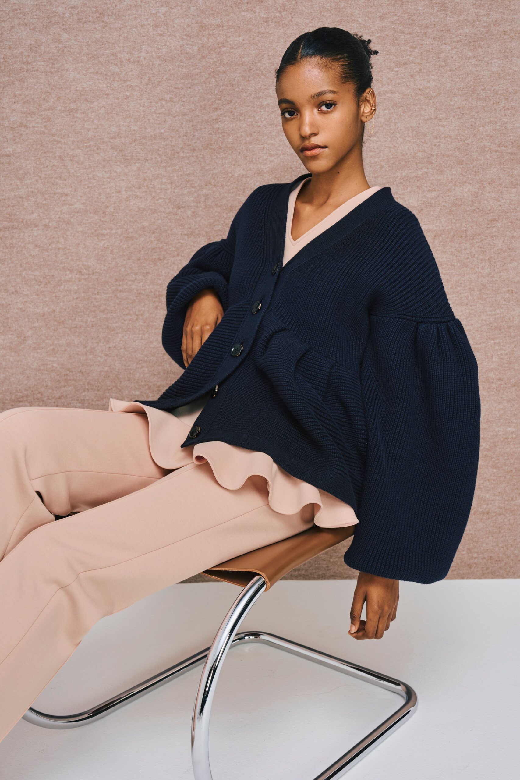 navy cardigan beige top pink pants