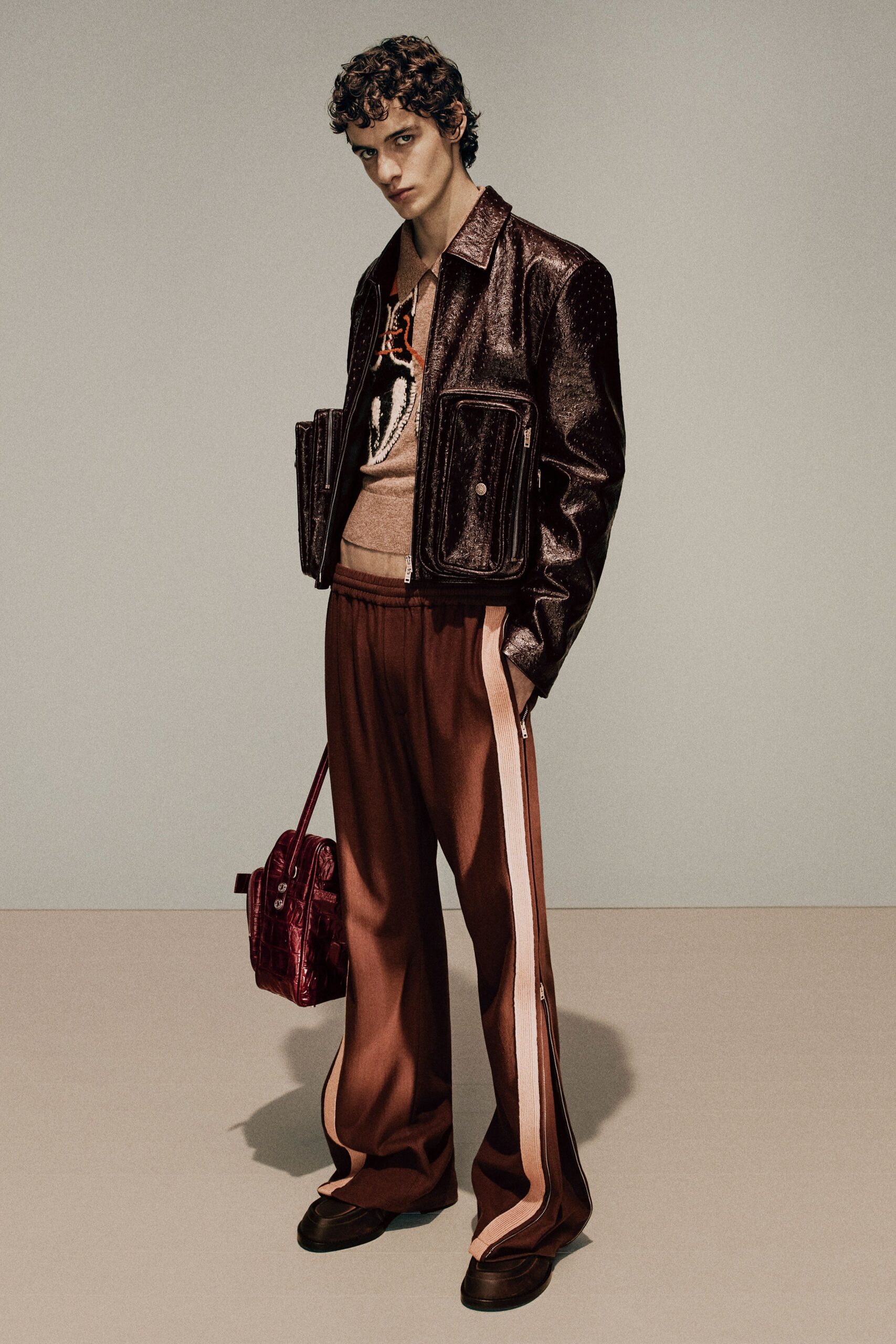 brown leather jacket with printed top