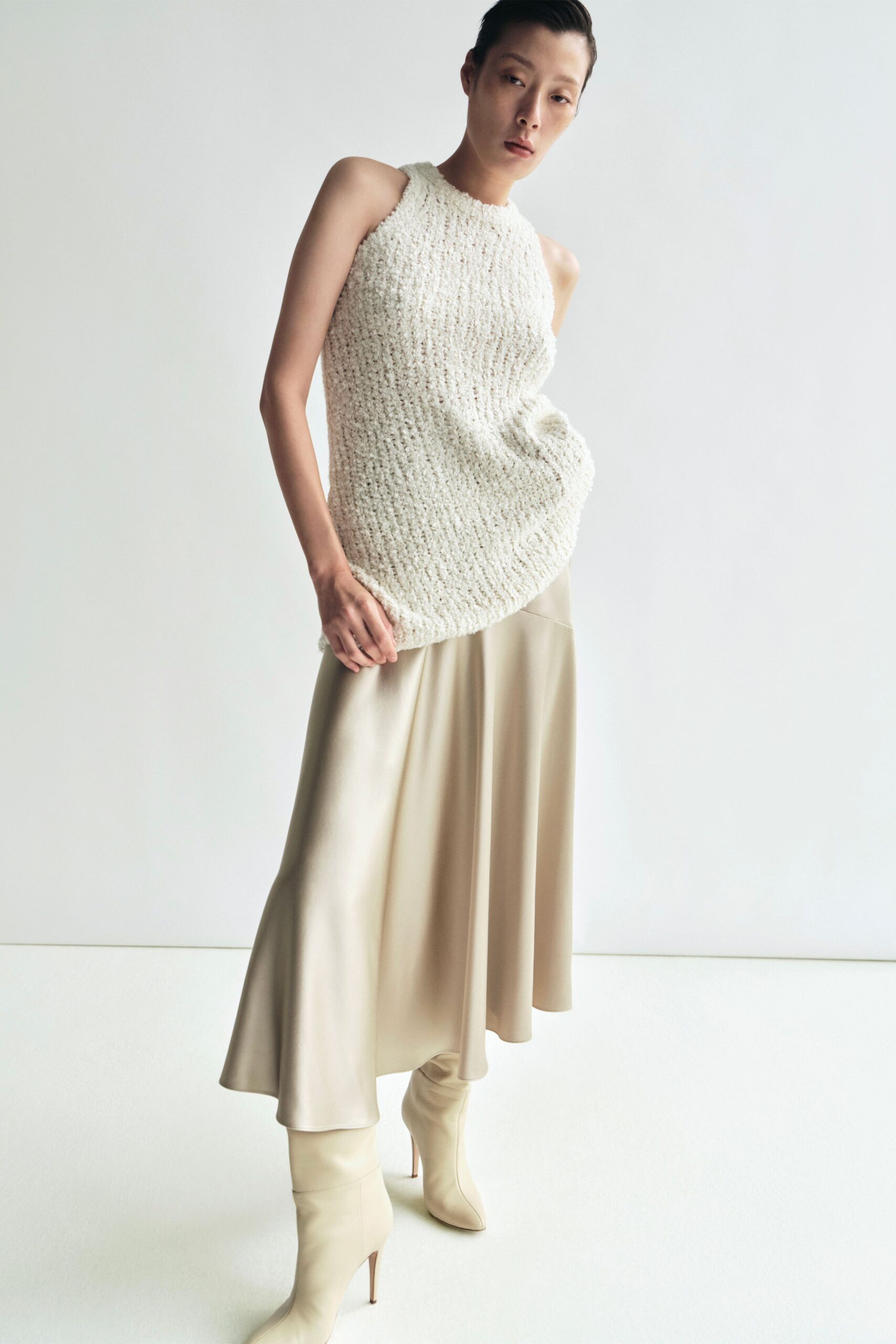 white knit sleeveless high-neck relaxed textured top