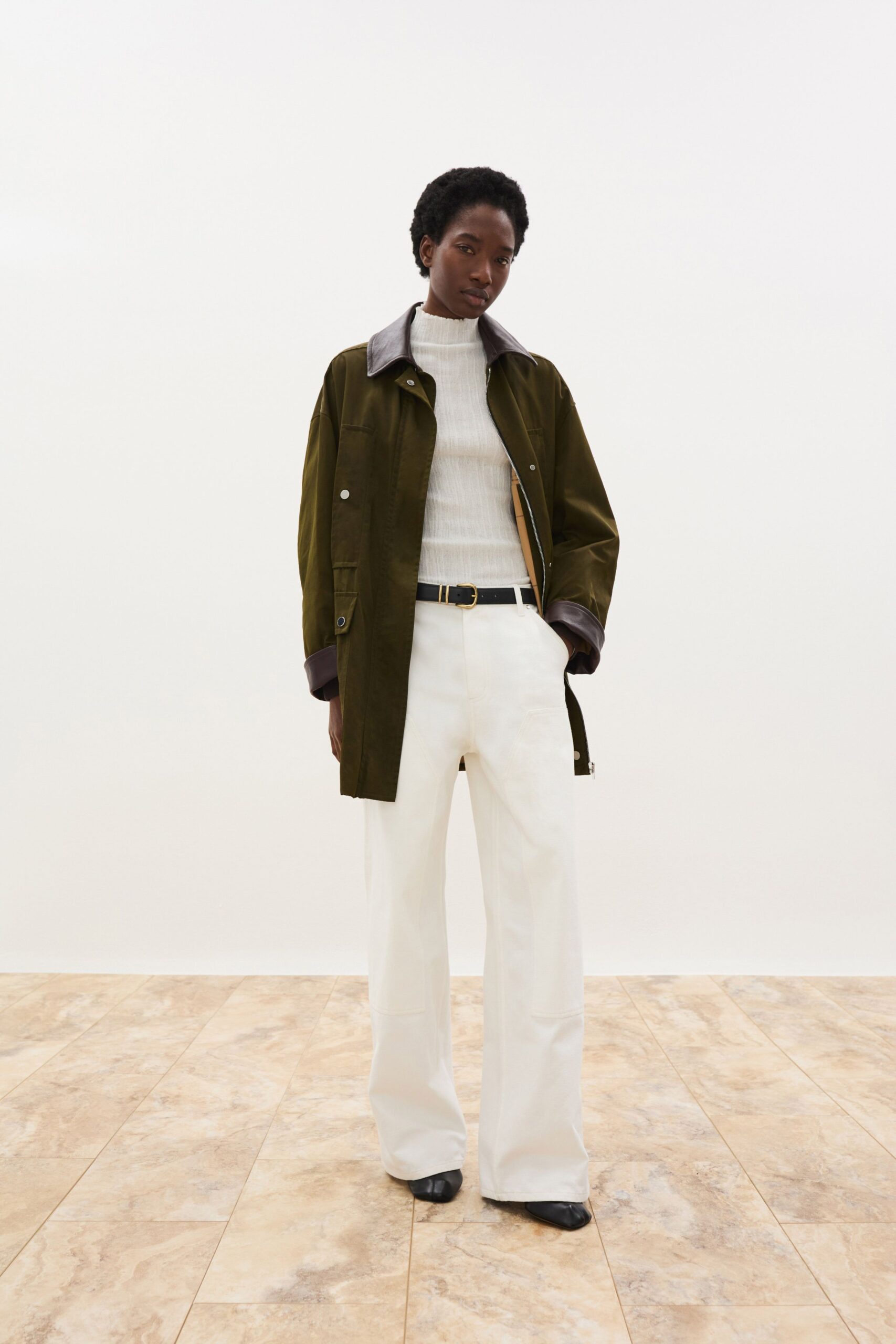 green jacket white top tailored pants