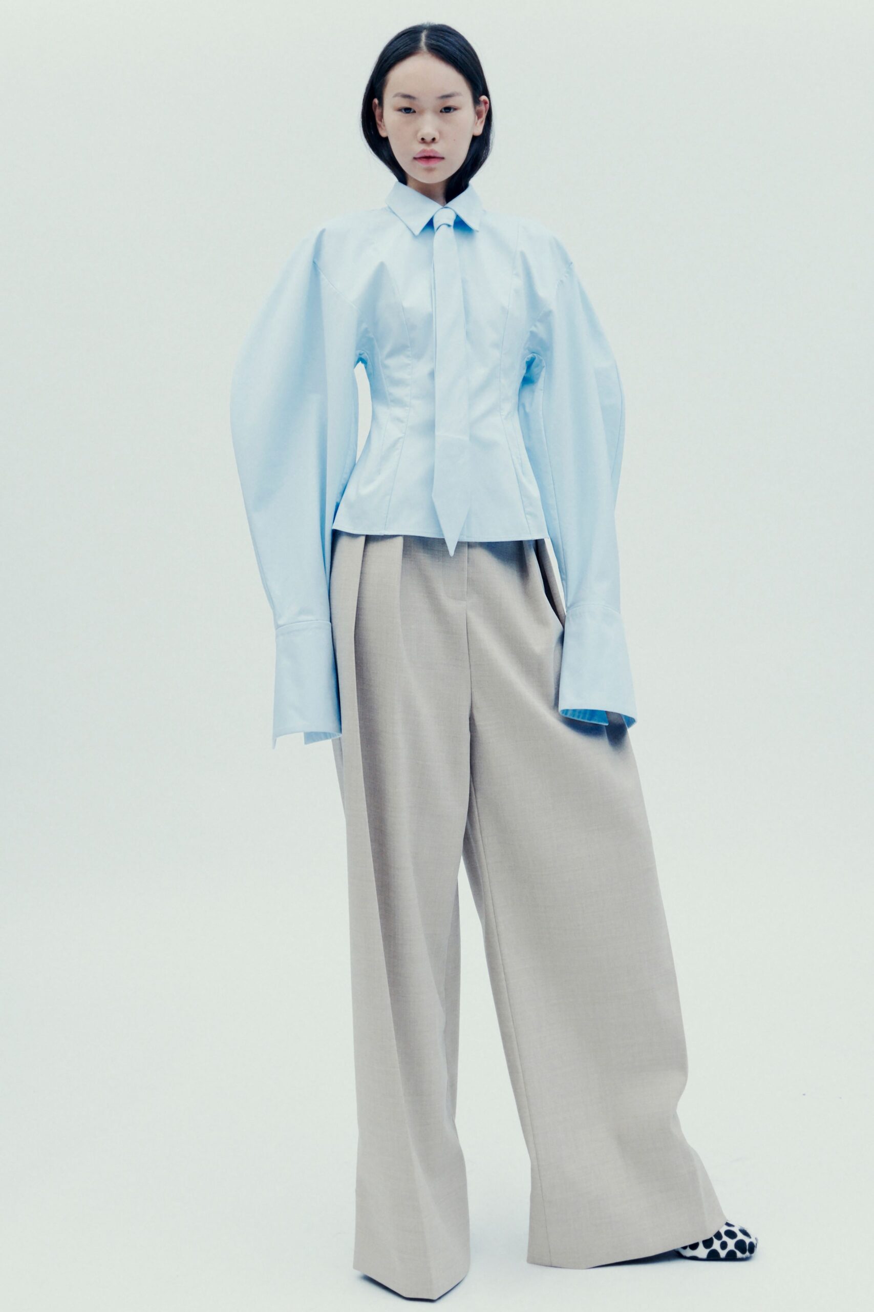 blue fitted shirt beige wide-leg pants