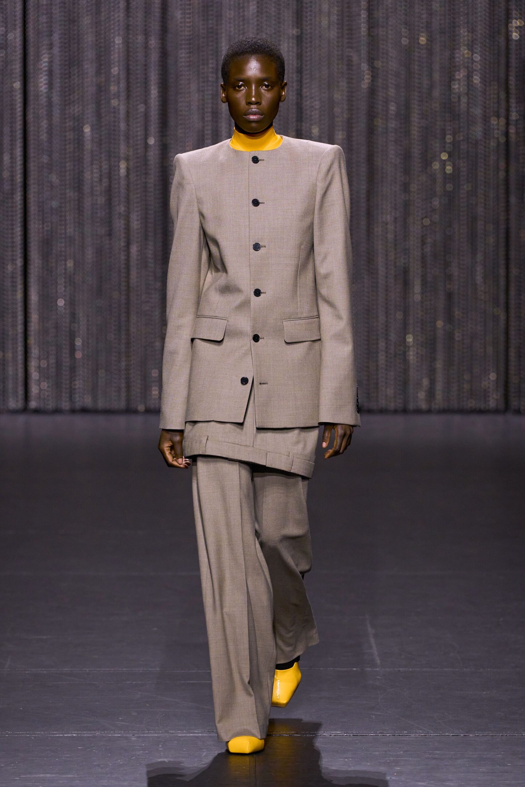 beige tailored suit with yellow top