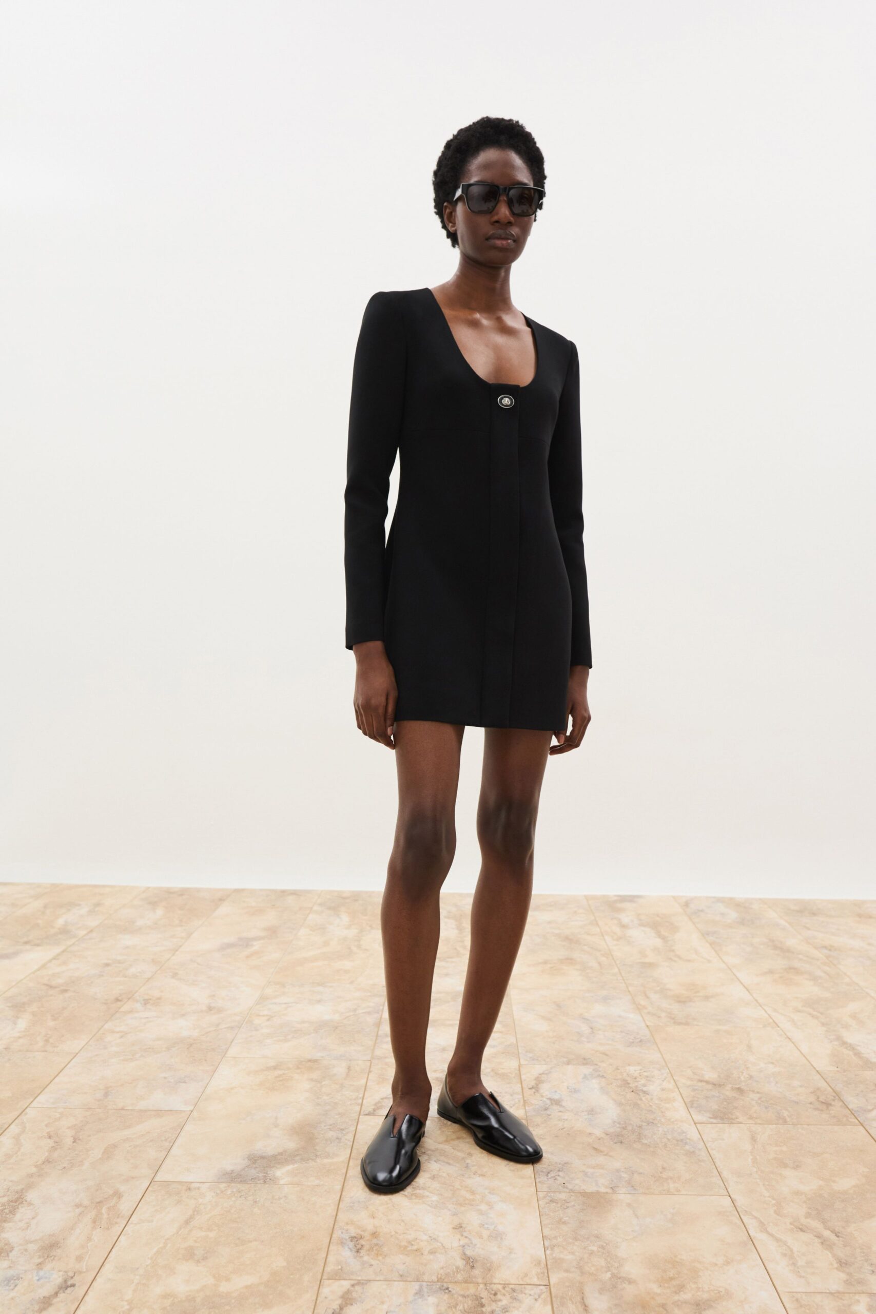 black mini-dress with sunglasses