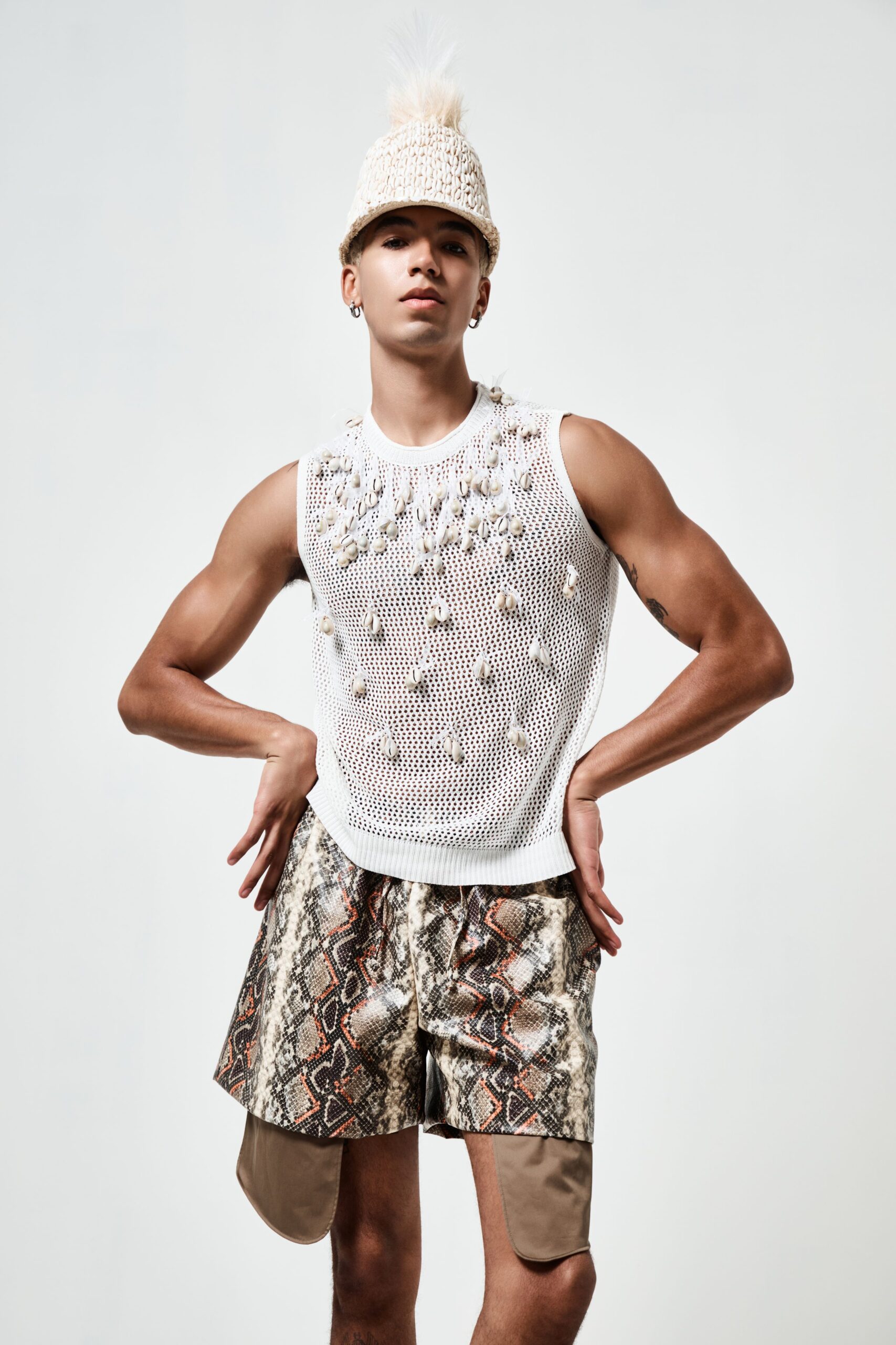 white embroidered sleeveless top with printed shorts
