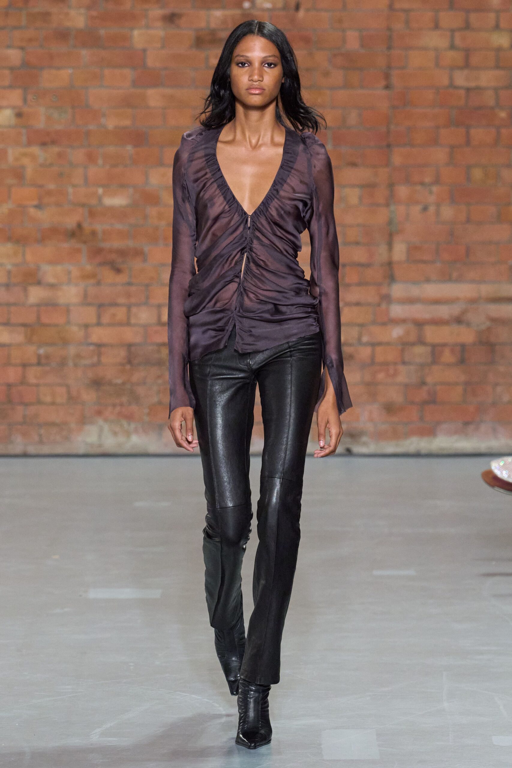 fitted black silk top with leather pants
