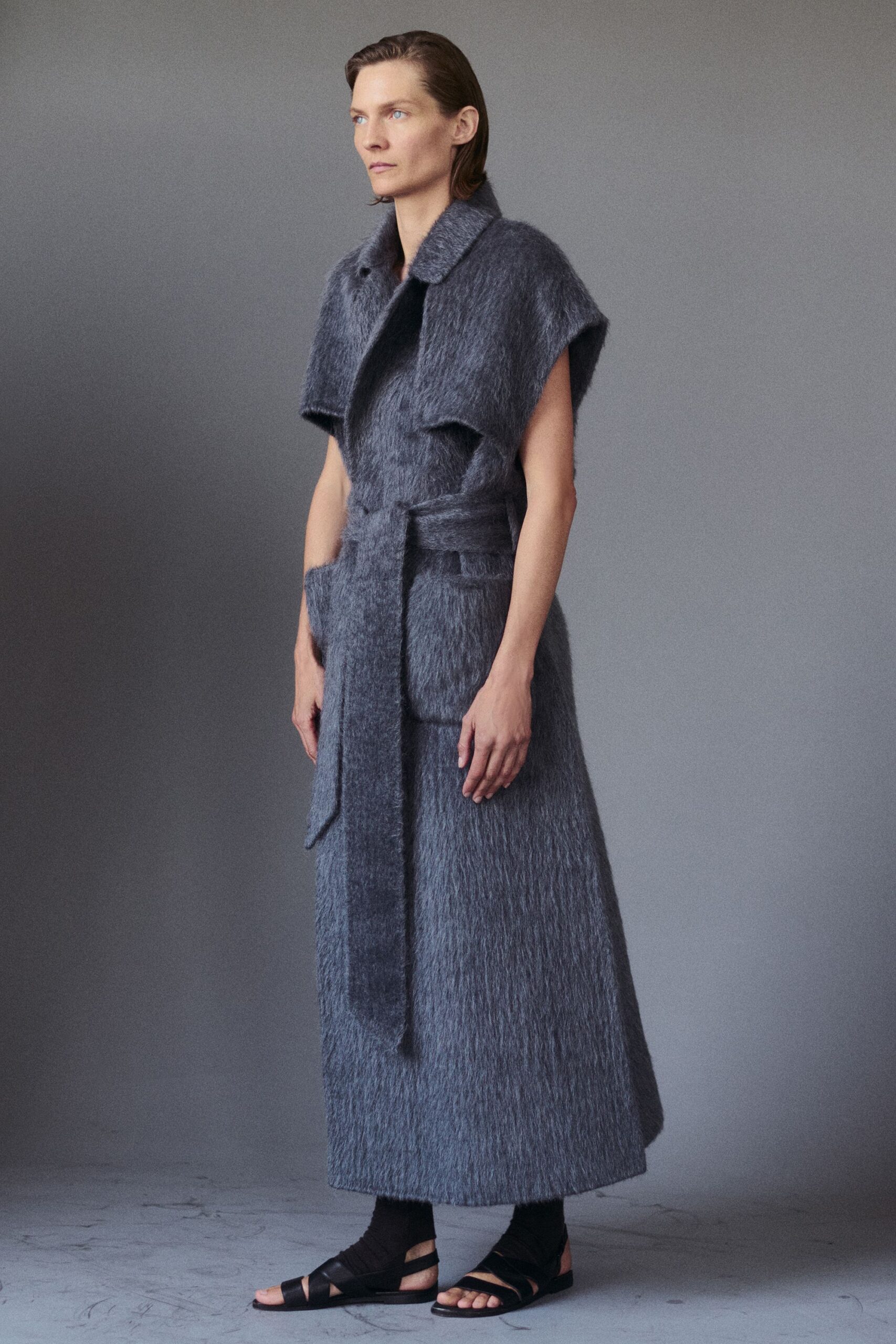 blue knit sleeveless collared structured belted layered dress