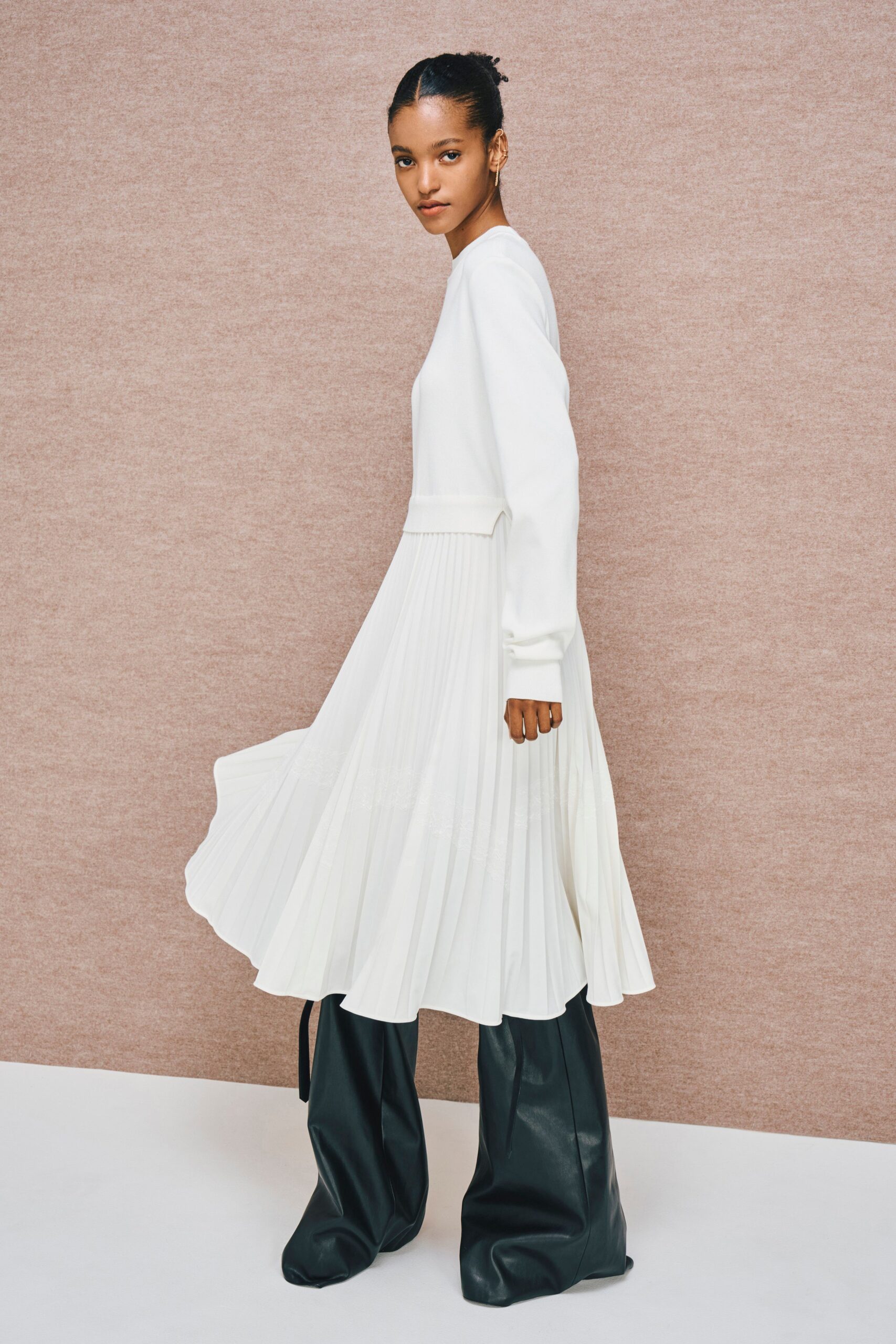 white pleated midi dress with black leather pants