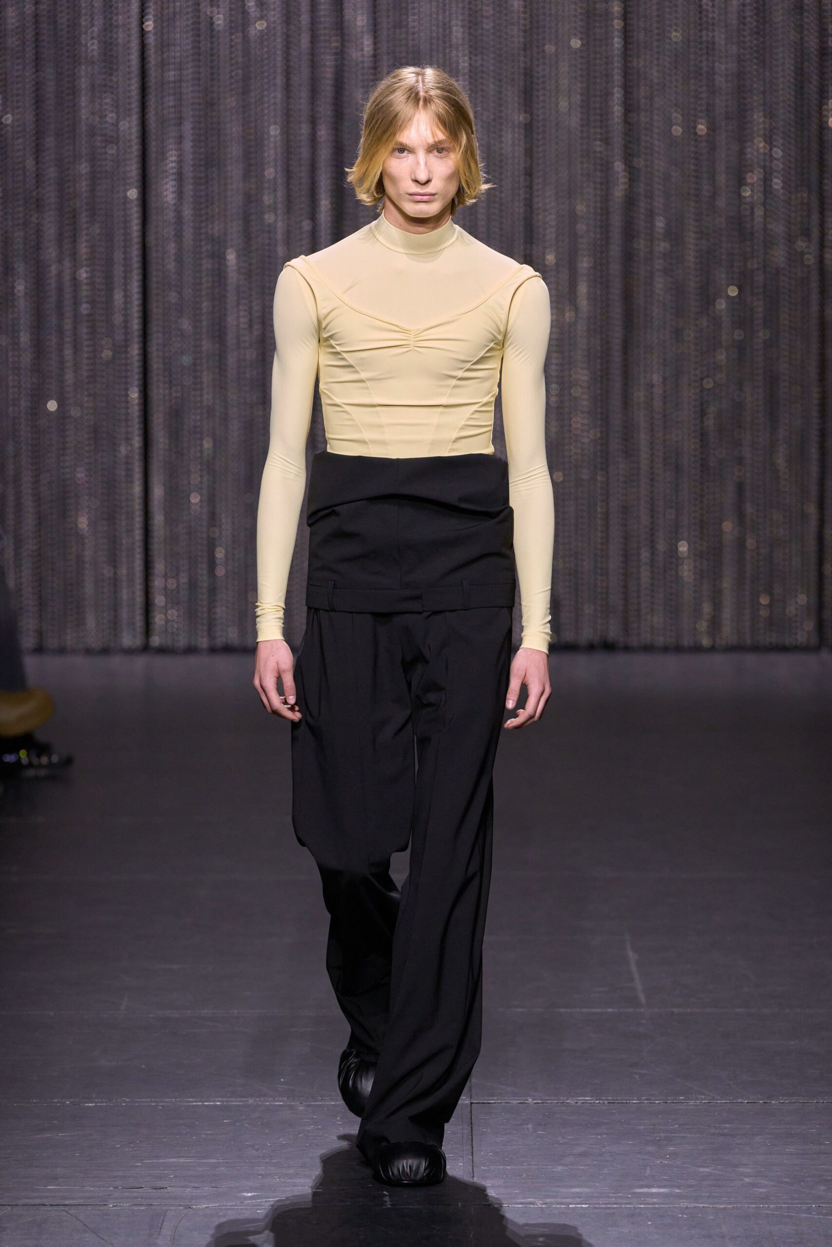 beige mesh fitted top with black pants