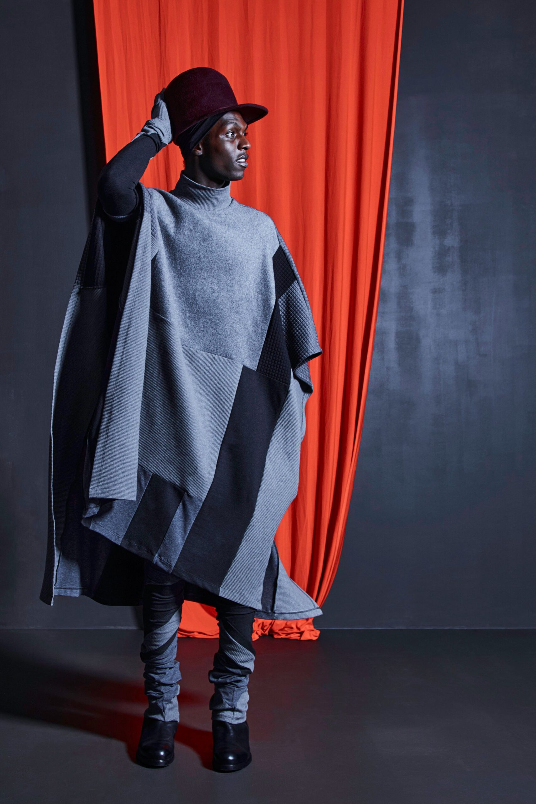 gray wool poncho with red hat