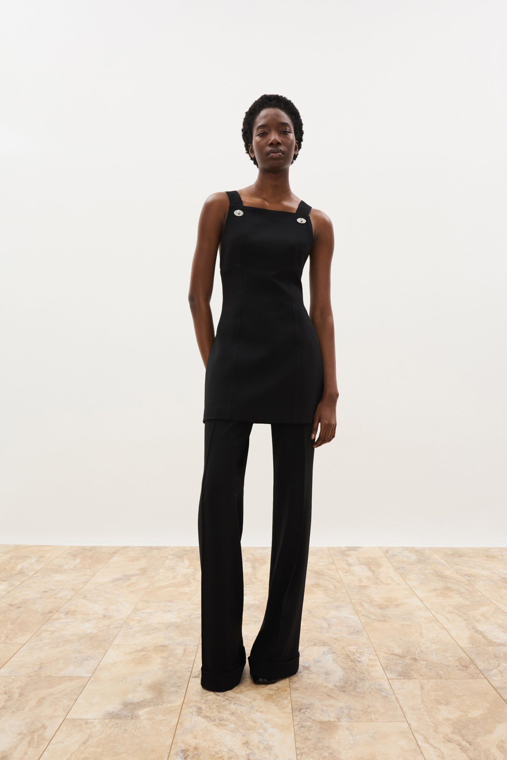 black fitted top with tailored pants