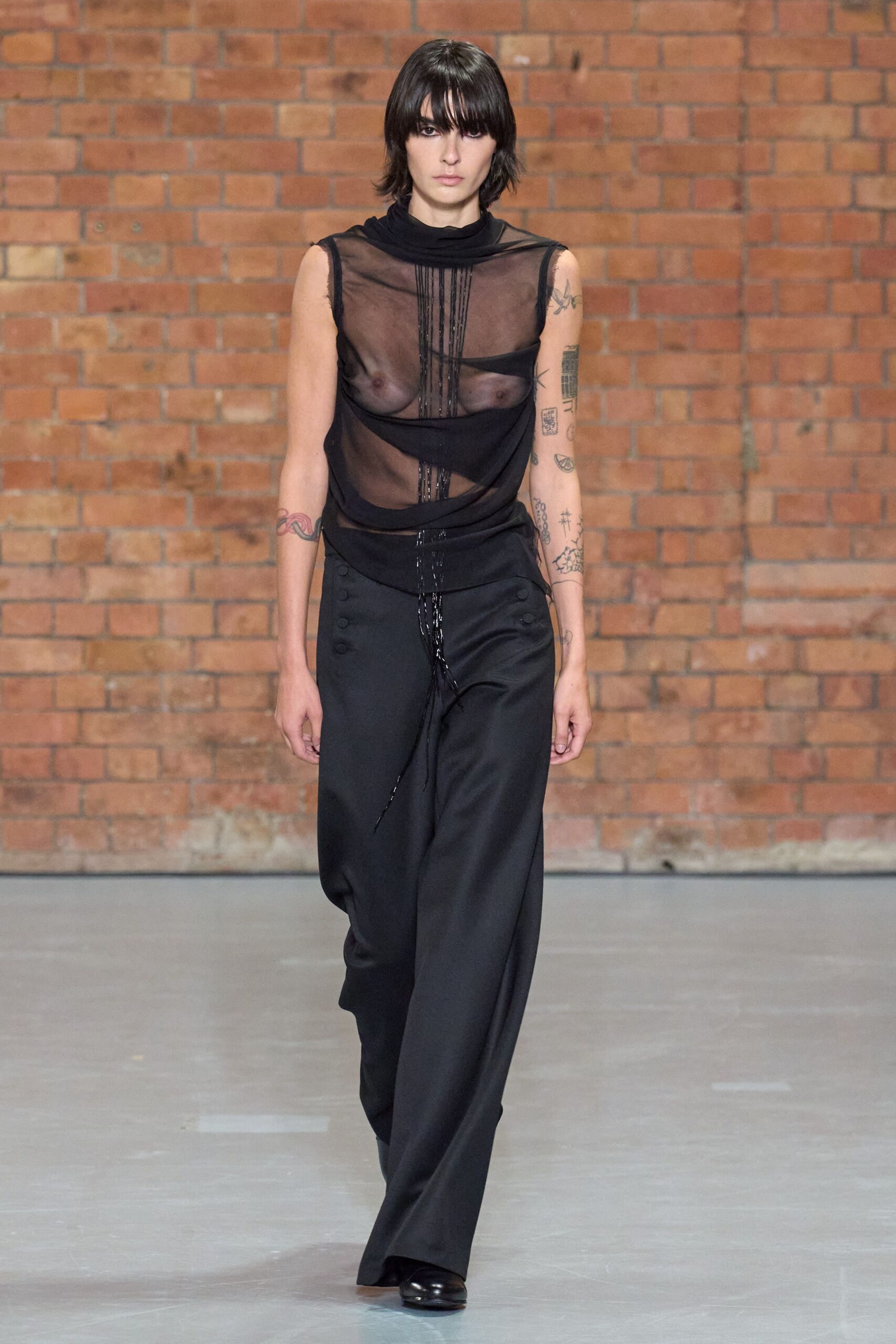 black mesh top with wide-leg pants