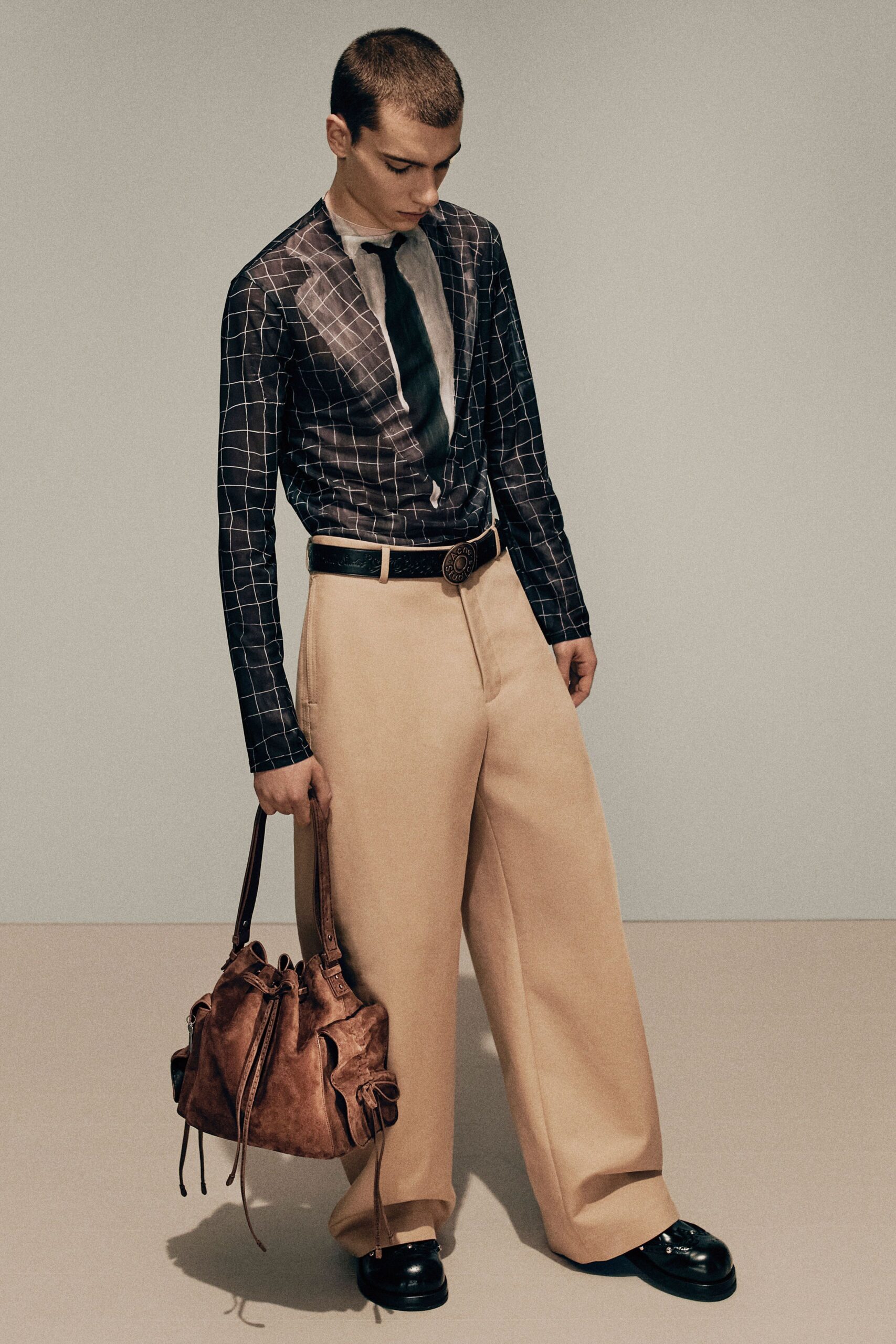 black and white checked shirt with beige pants