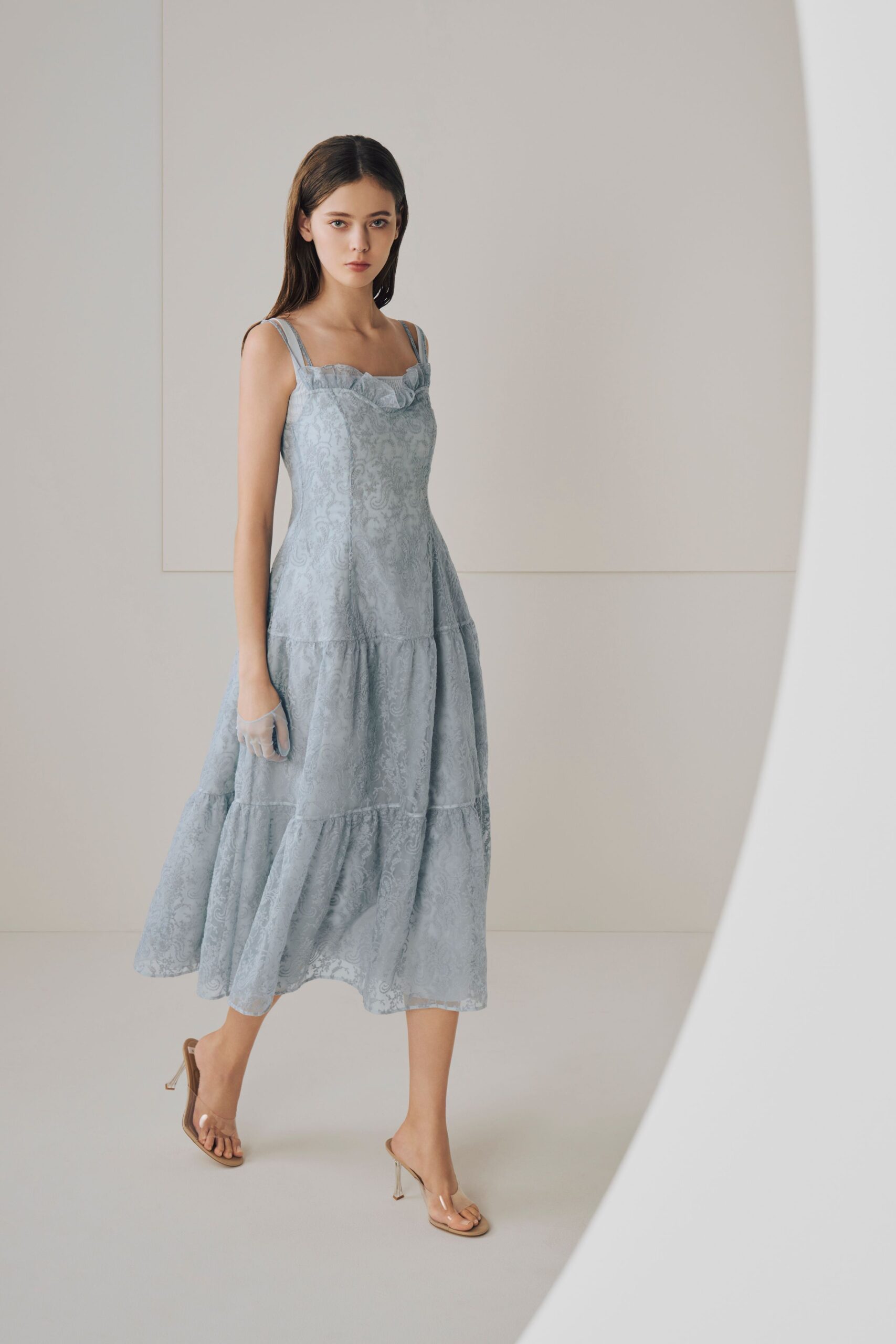 blue lace midi dress with gold shoes