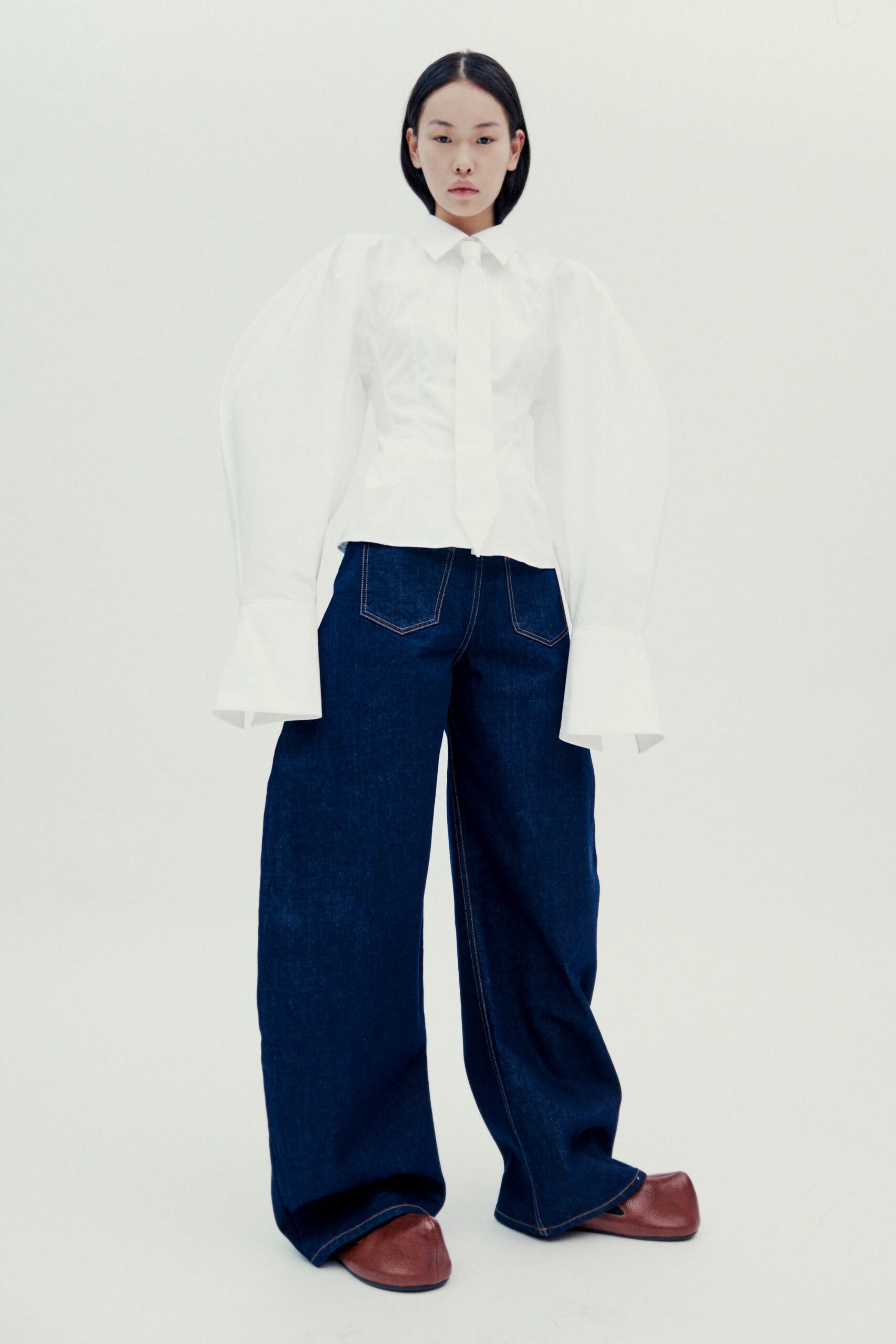 white fitted shirt with wide-leg jeans