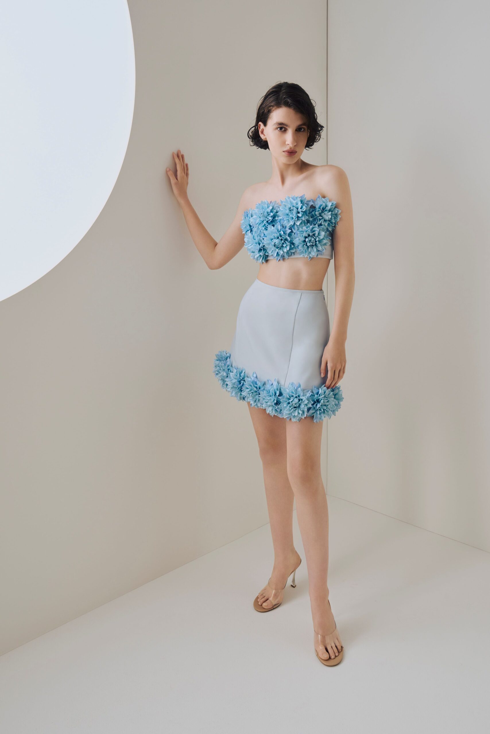 blue embellished top and mini skirt