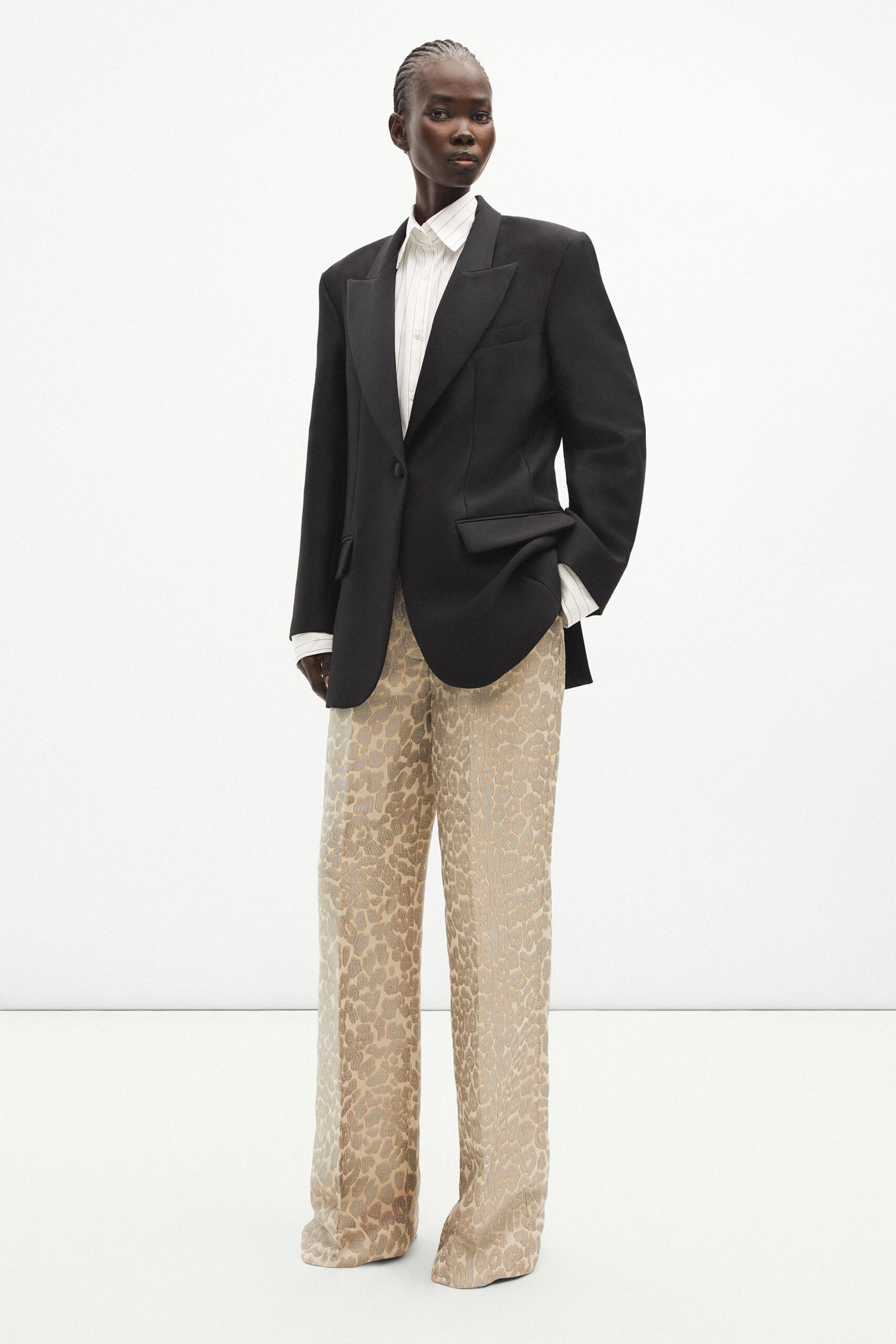 black blazer white shirt beige animal-print pants