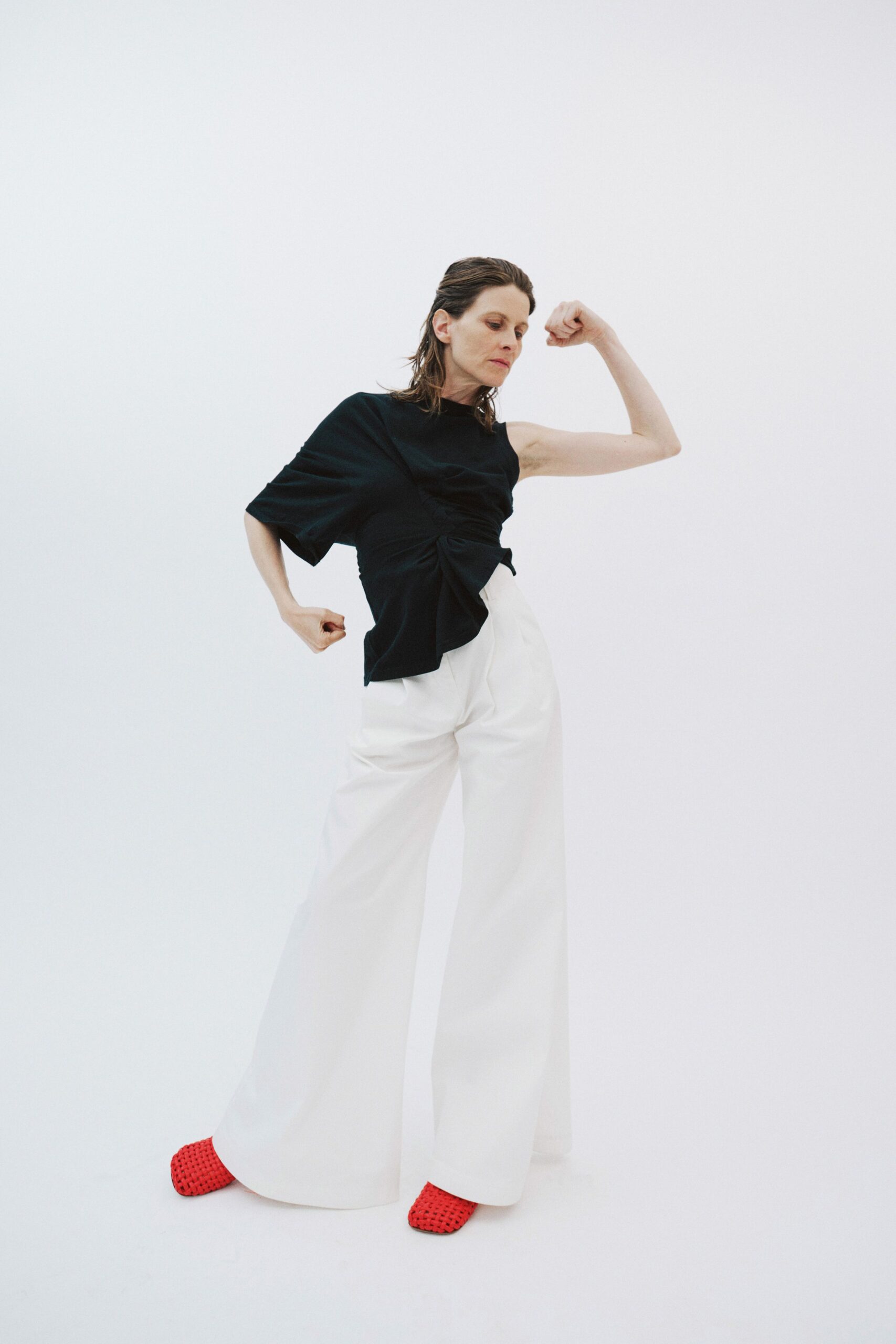 black fitted top white wide-leg pants