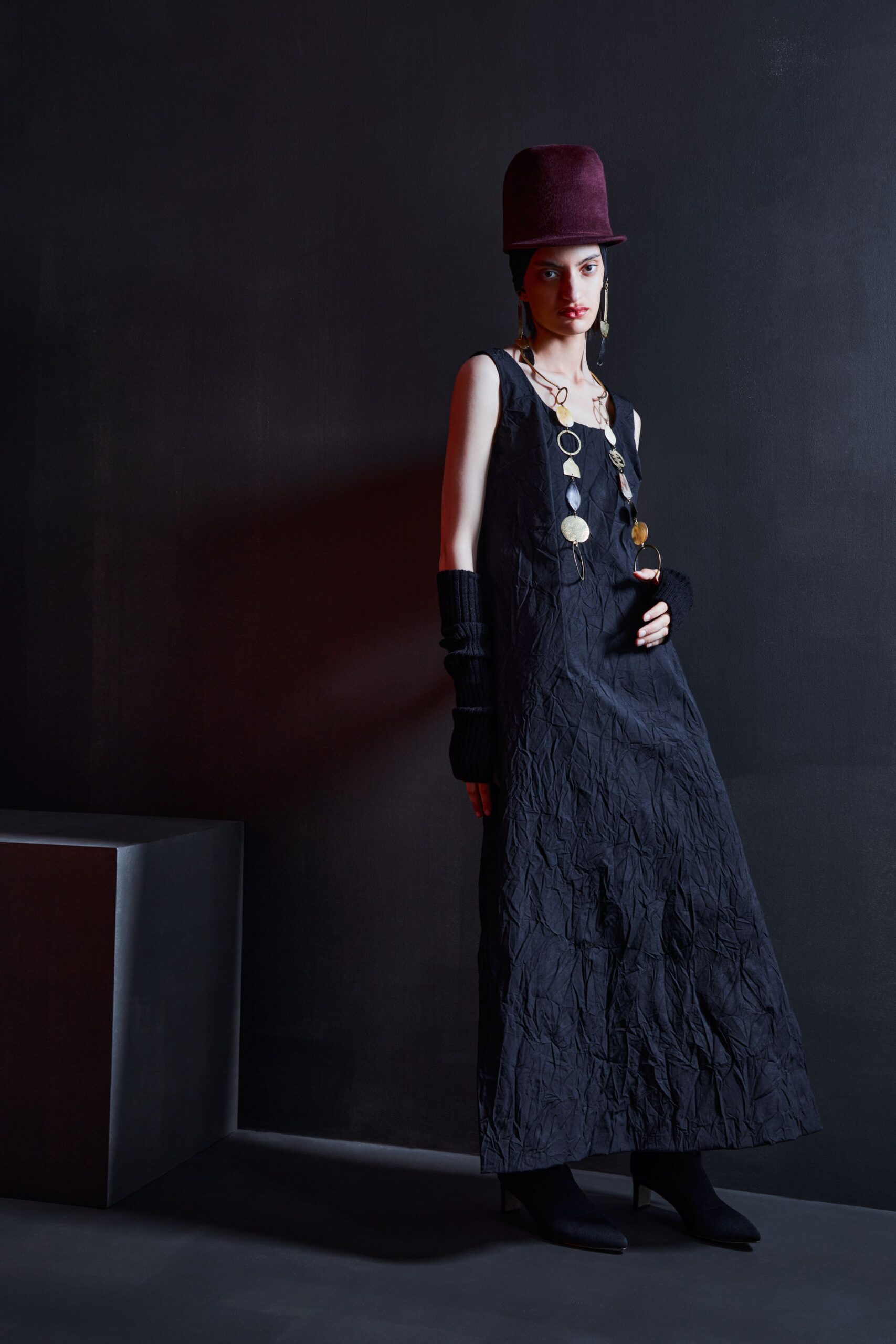 black draped maxi dress with accessories