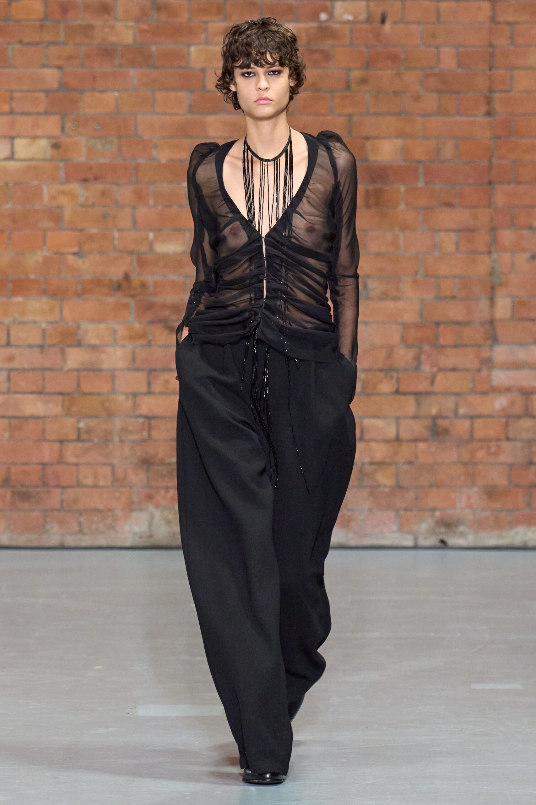 black mesh top with wide-leg pants