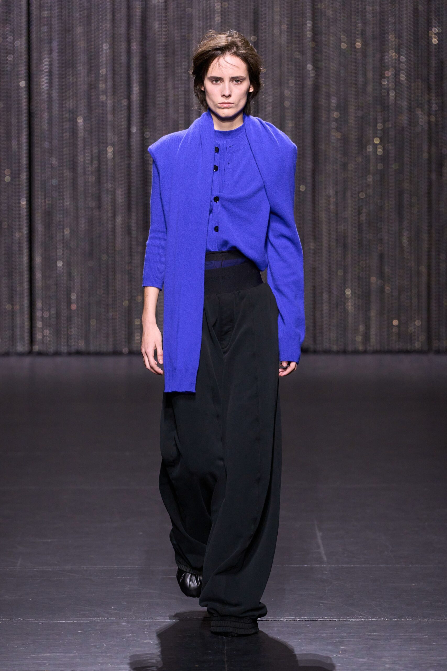 blue relaxed top with black pants