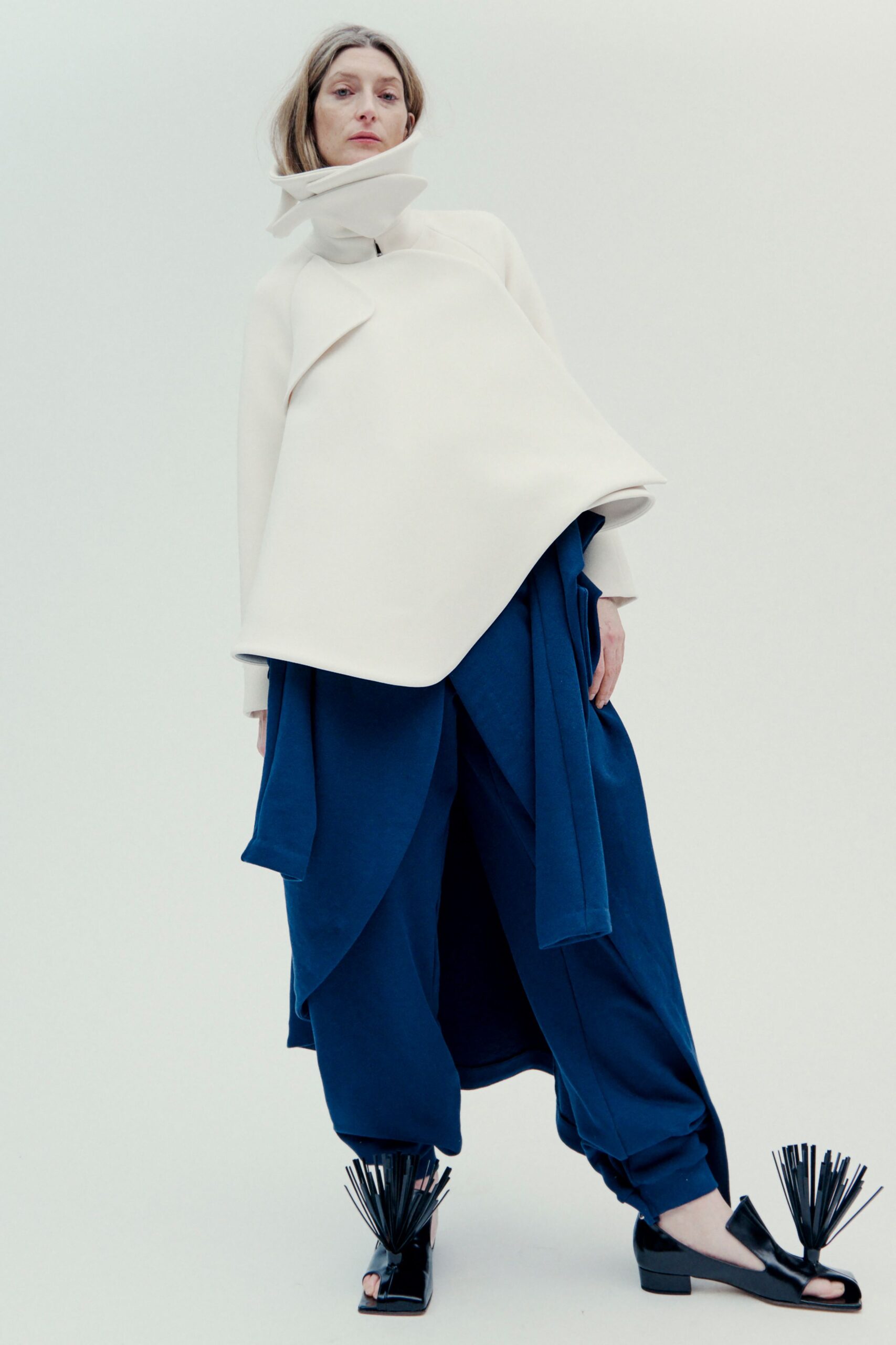 white relaxed top blue pants