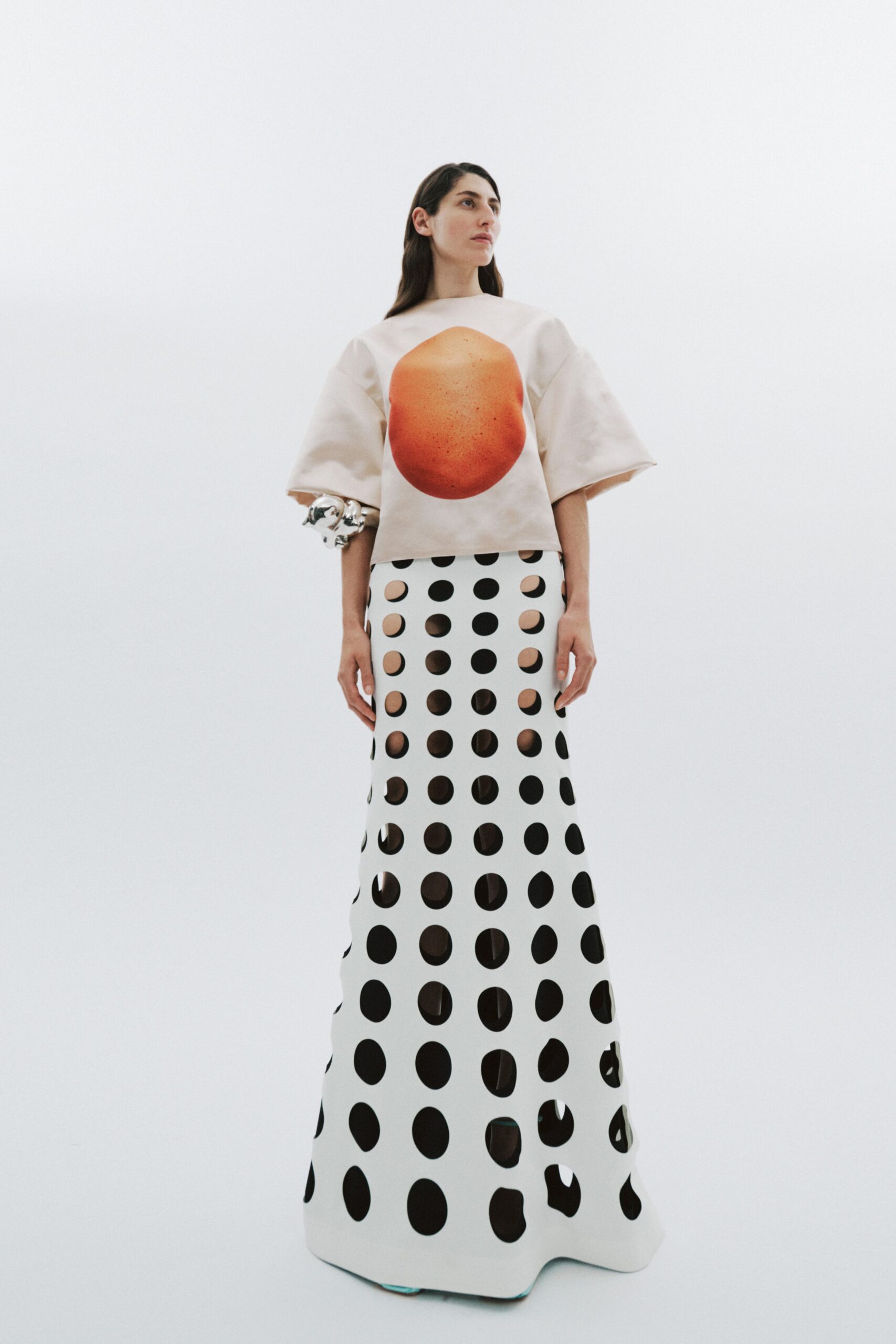 beige printed top and white cutout skirt