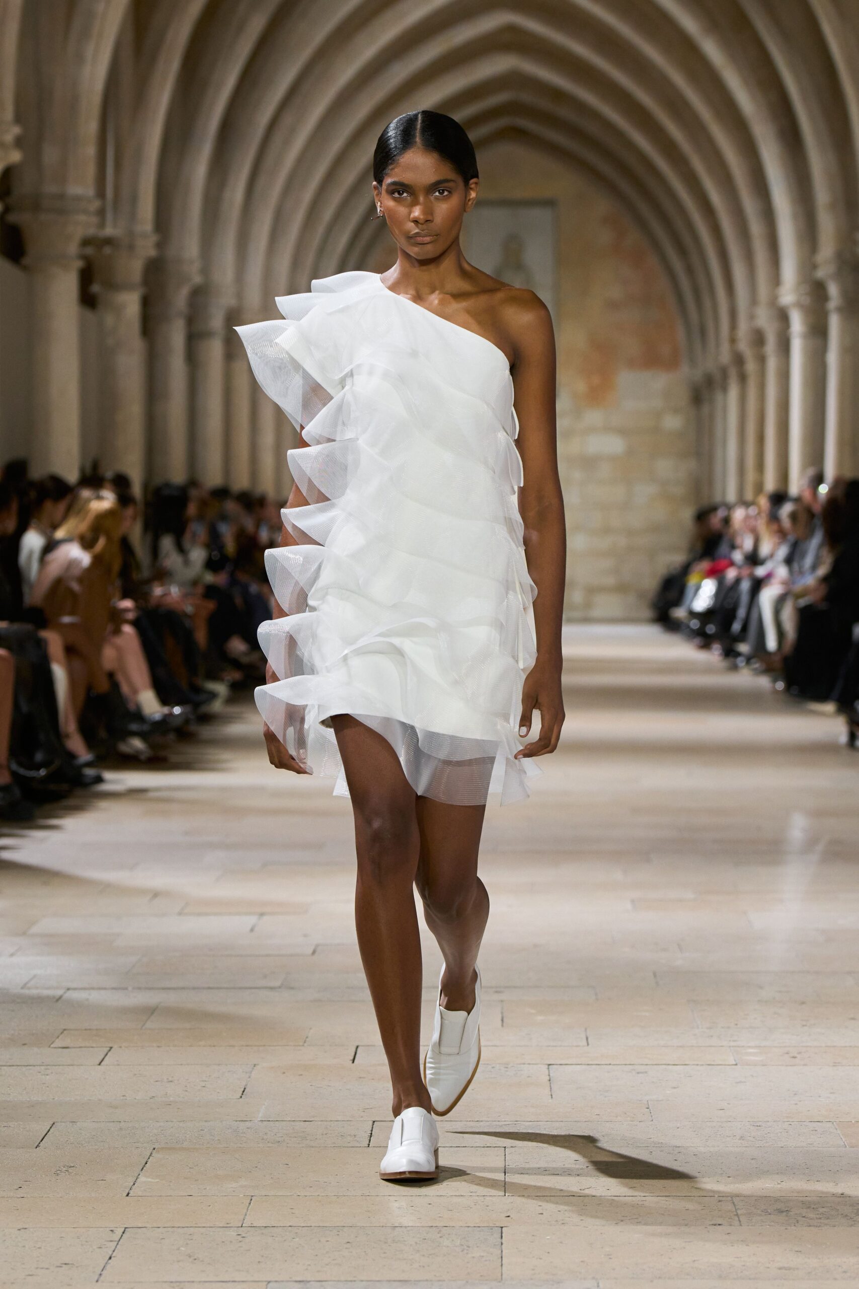 white tulle sleeveless asymmetric fitted ruffled flowing dress