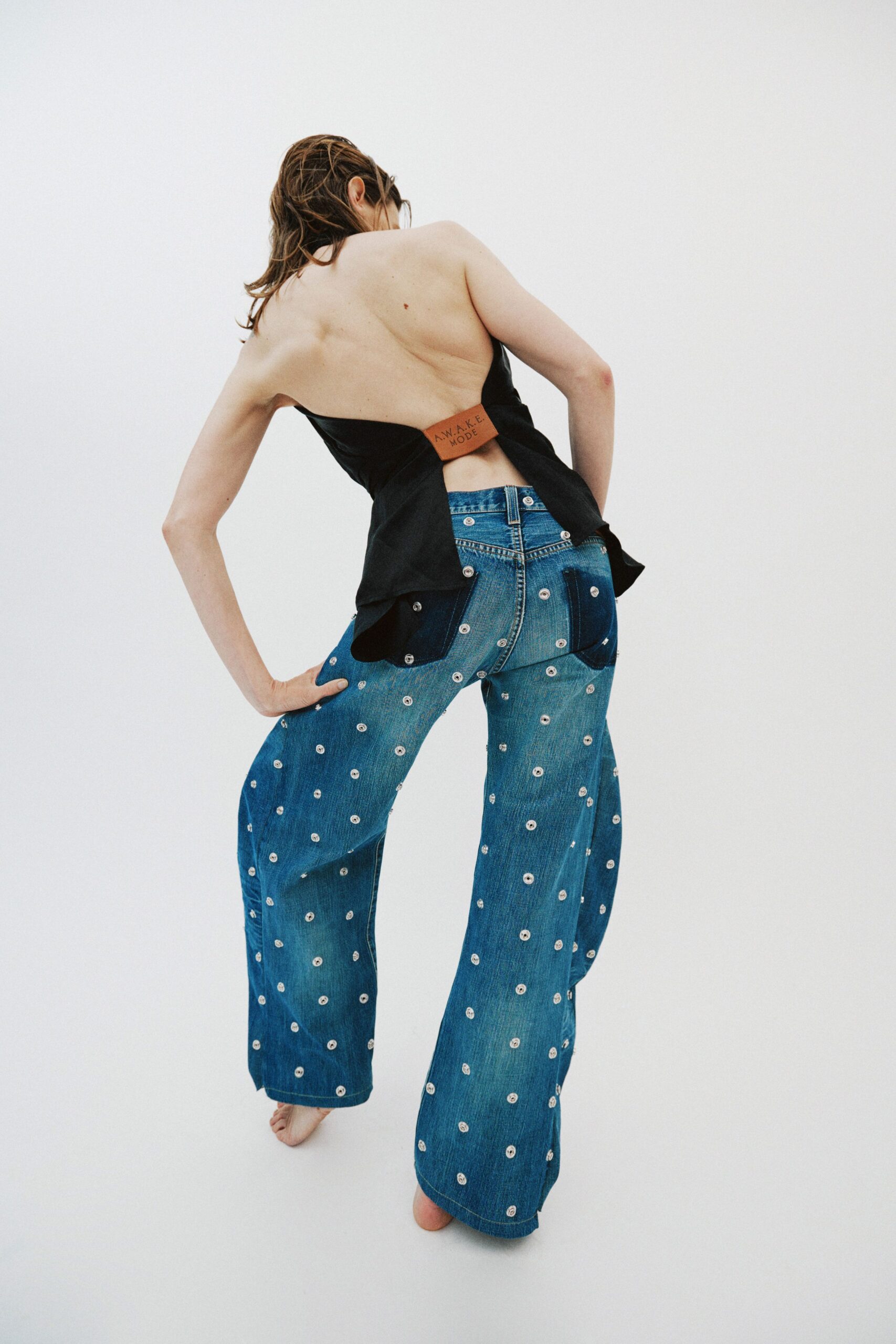 black fitted top and blue jeans