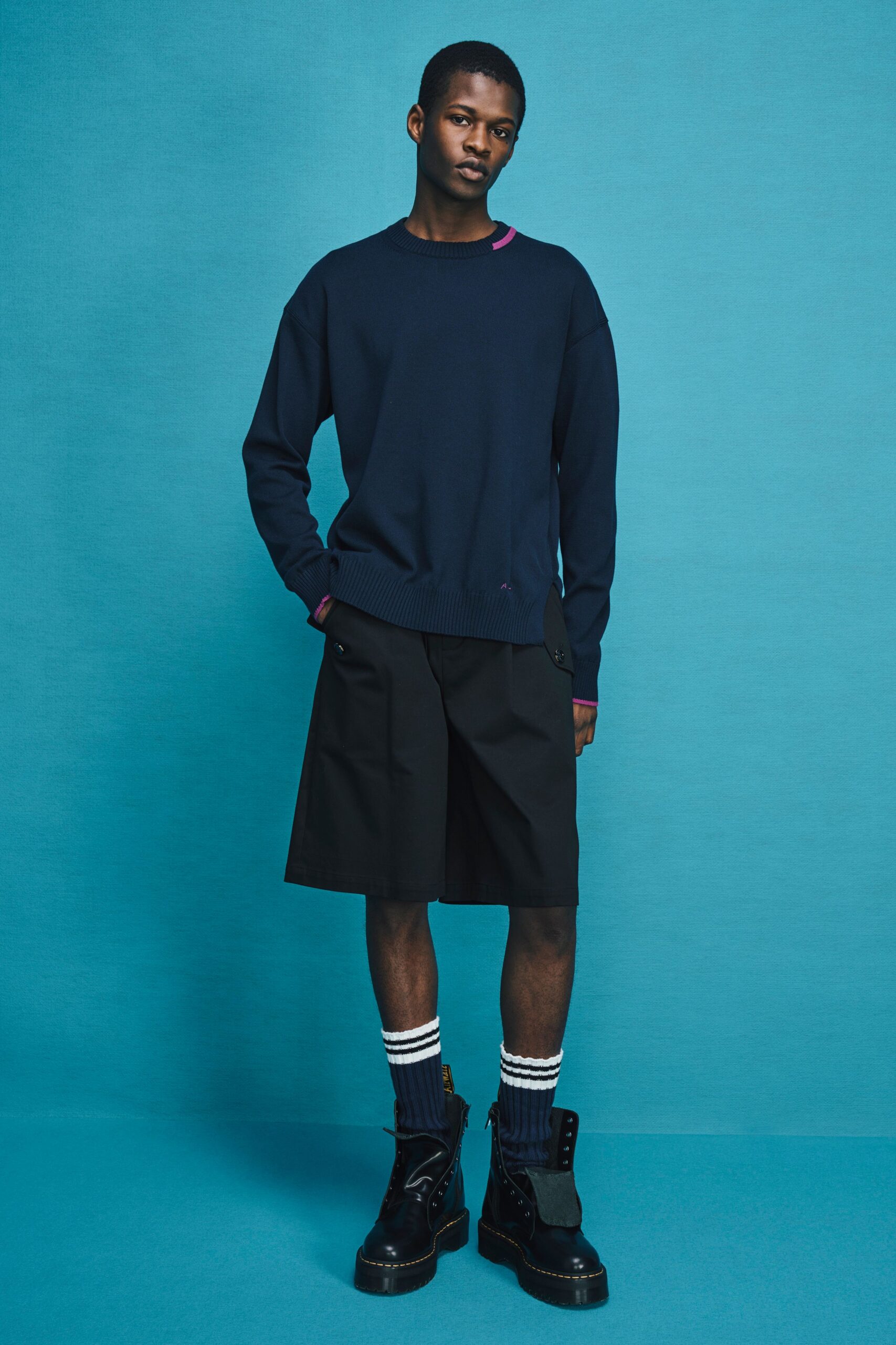 navy sweater black shorts boots