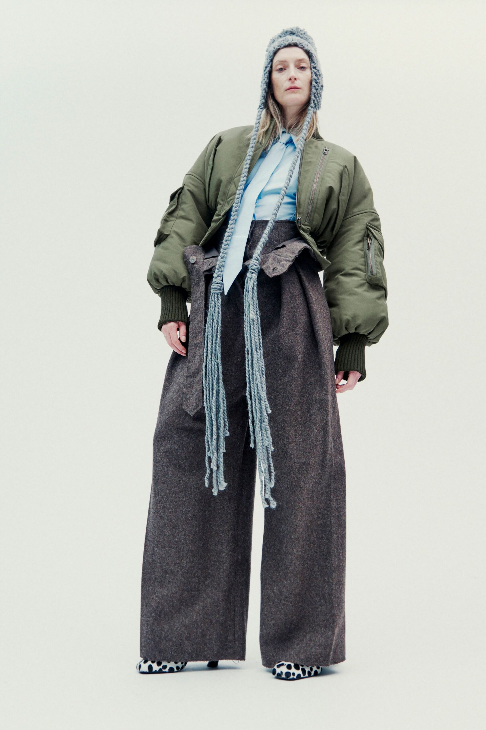 oversized green jacket with gray pants