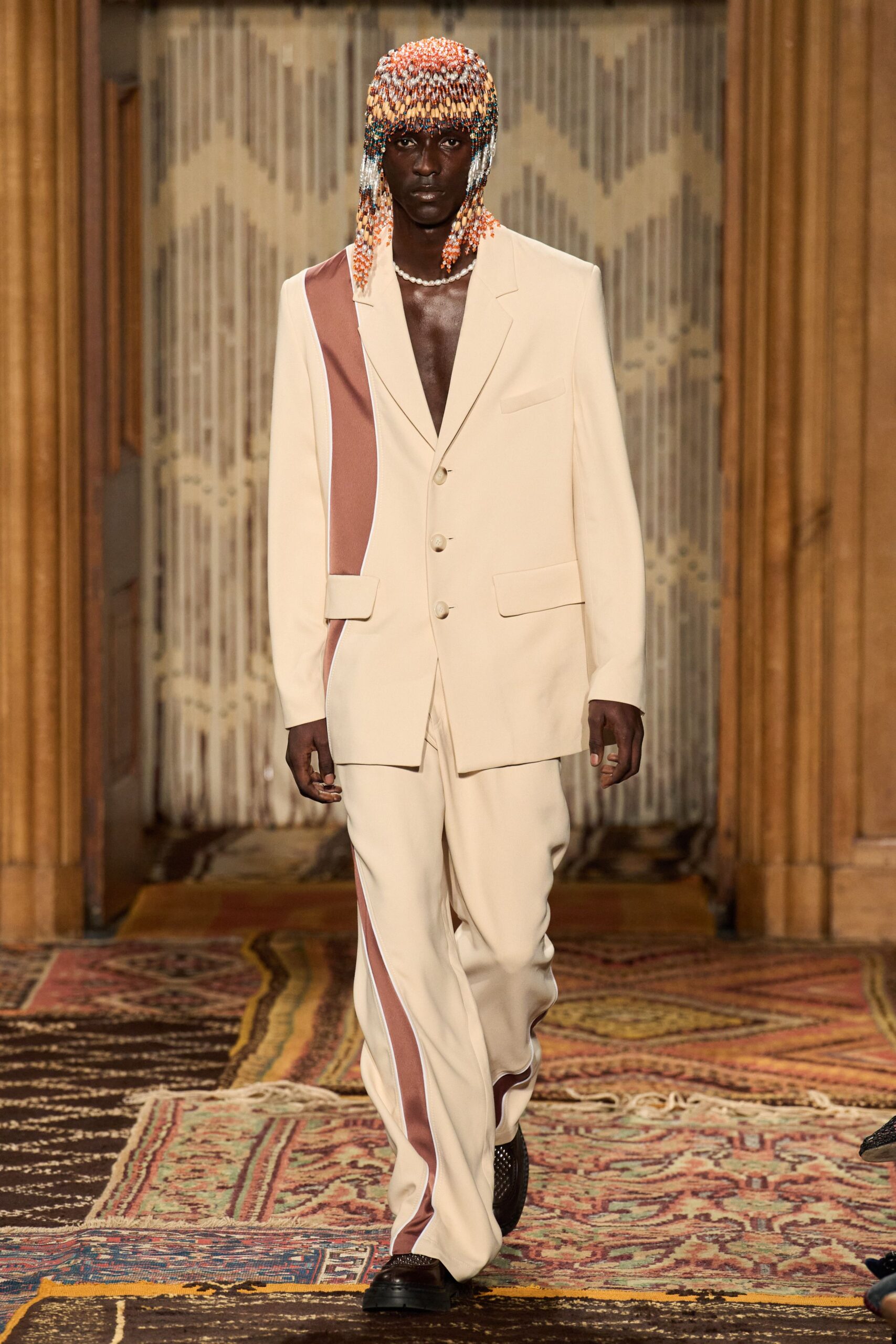 white tailored suit with brown accents