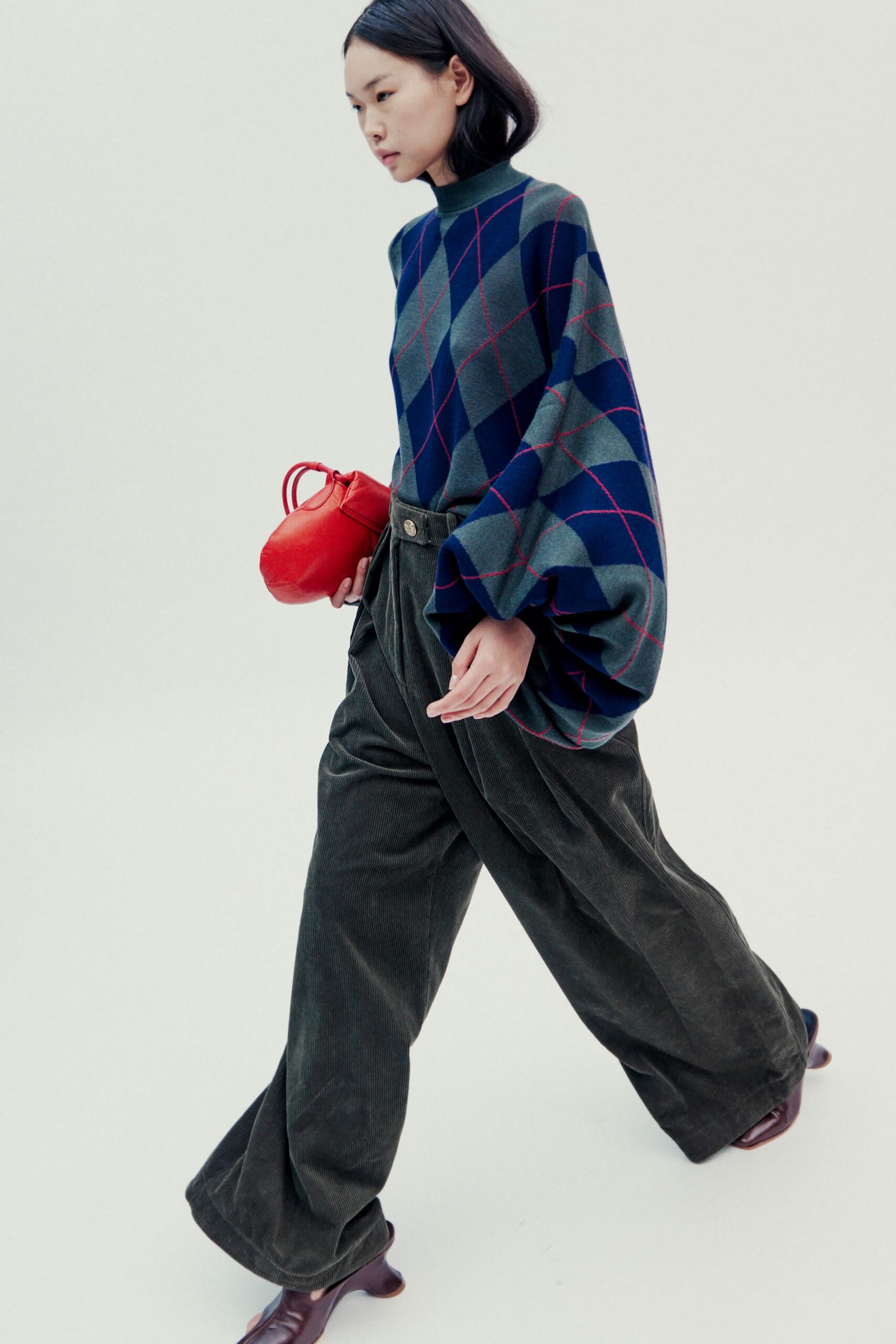 blue gray checked top with green pants