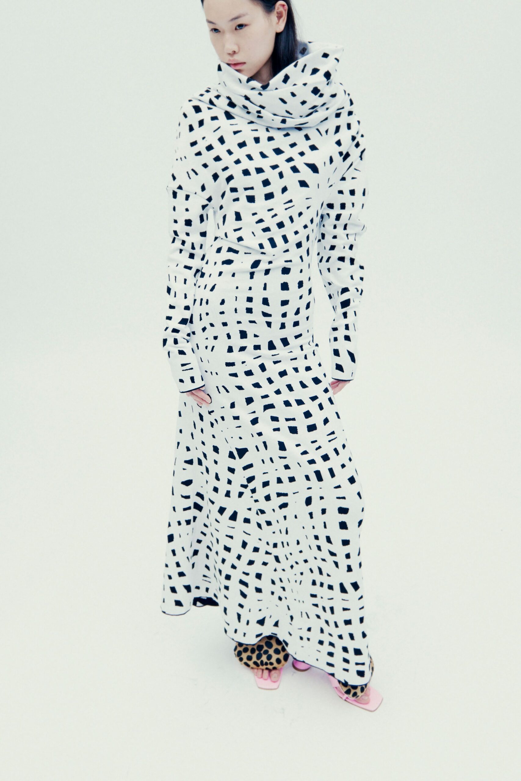 white and black printed gown with pink shoes