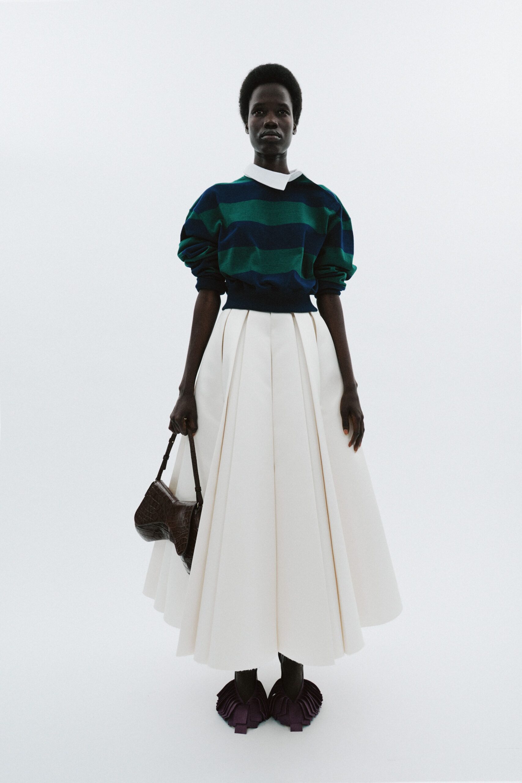 blue green striped sweater white pleated skirt