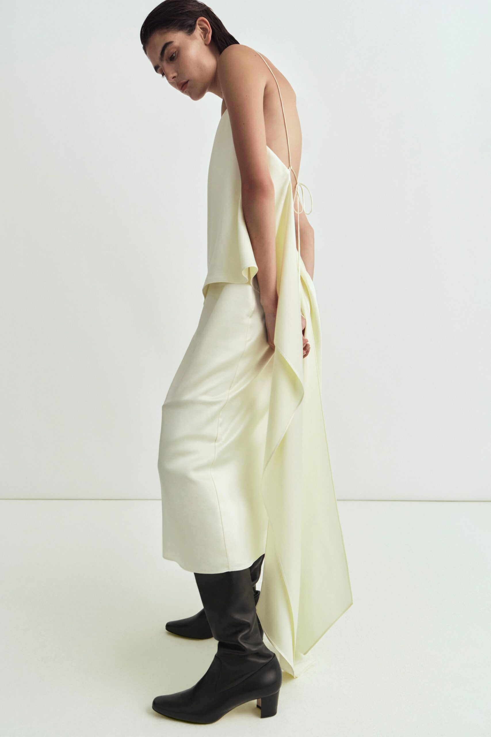 yellow silk sleeveless backless fitted draped flowing dress