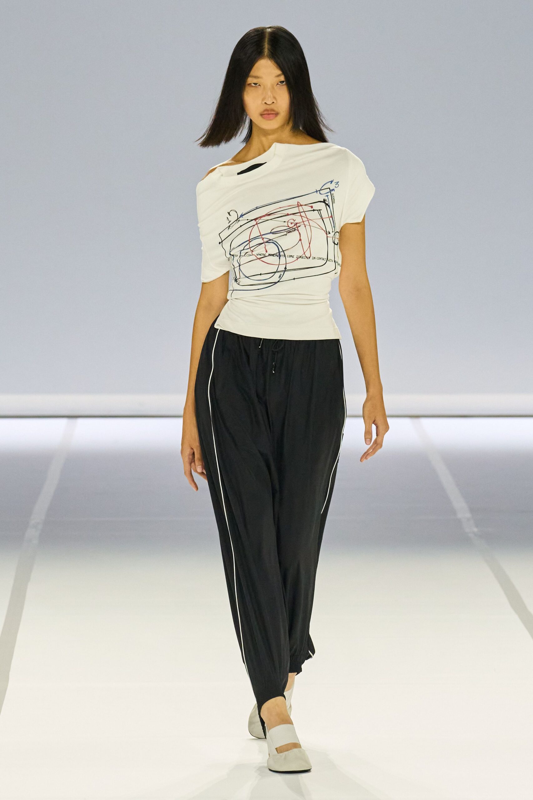 white relaxed top with black pants