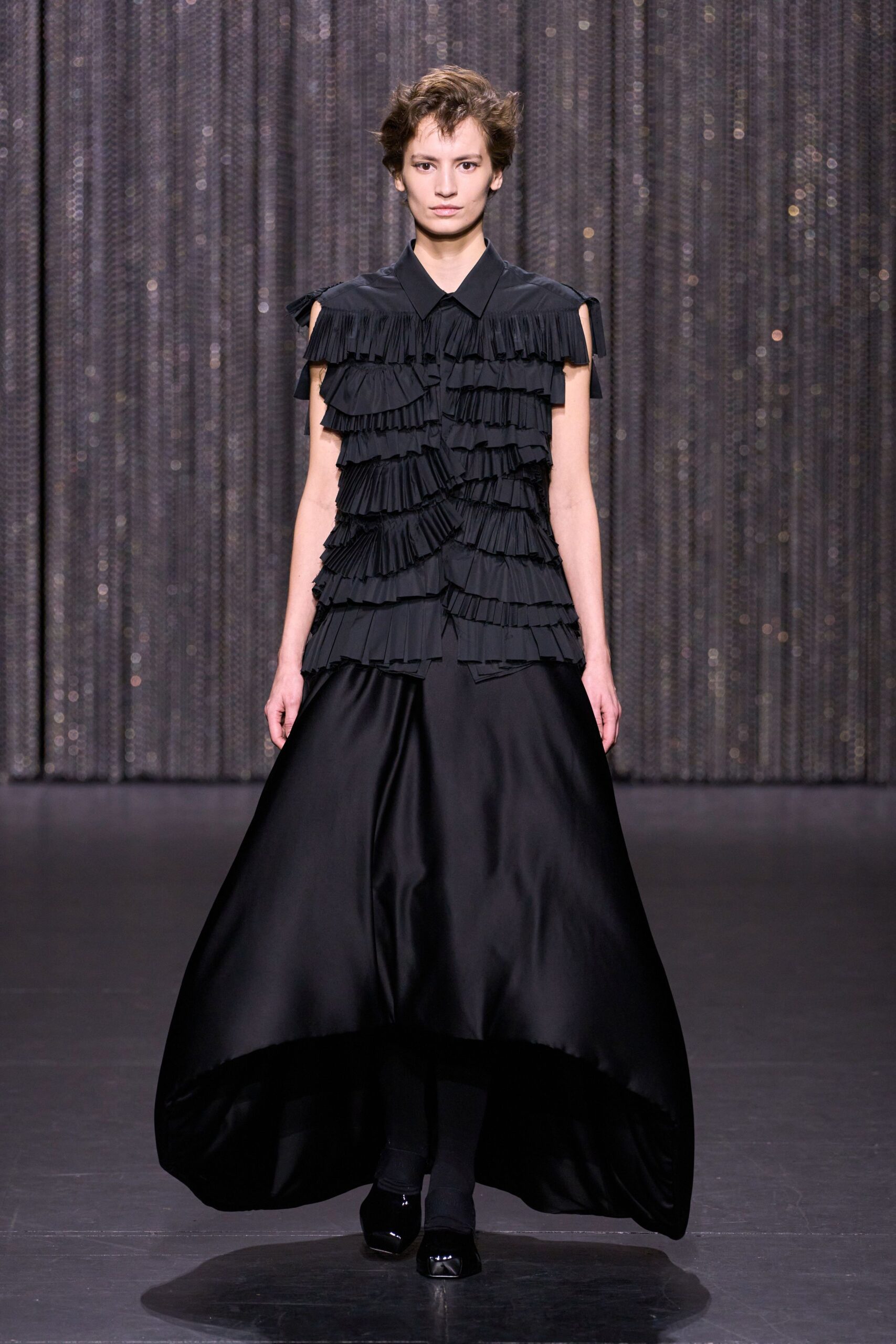 black pleated sleeveless dress