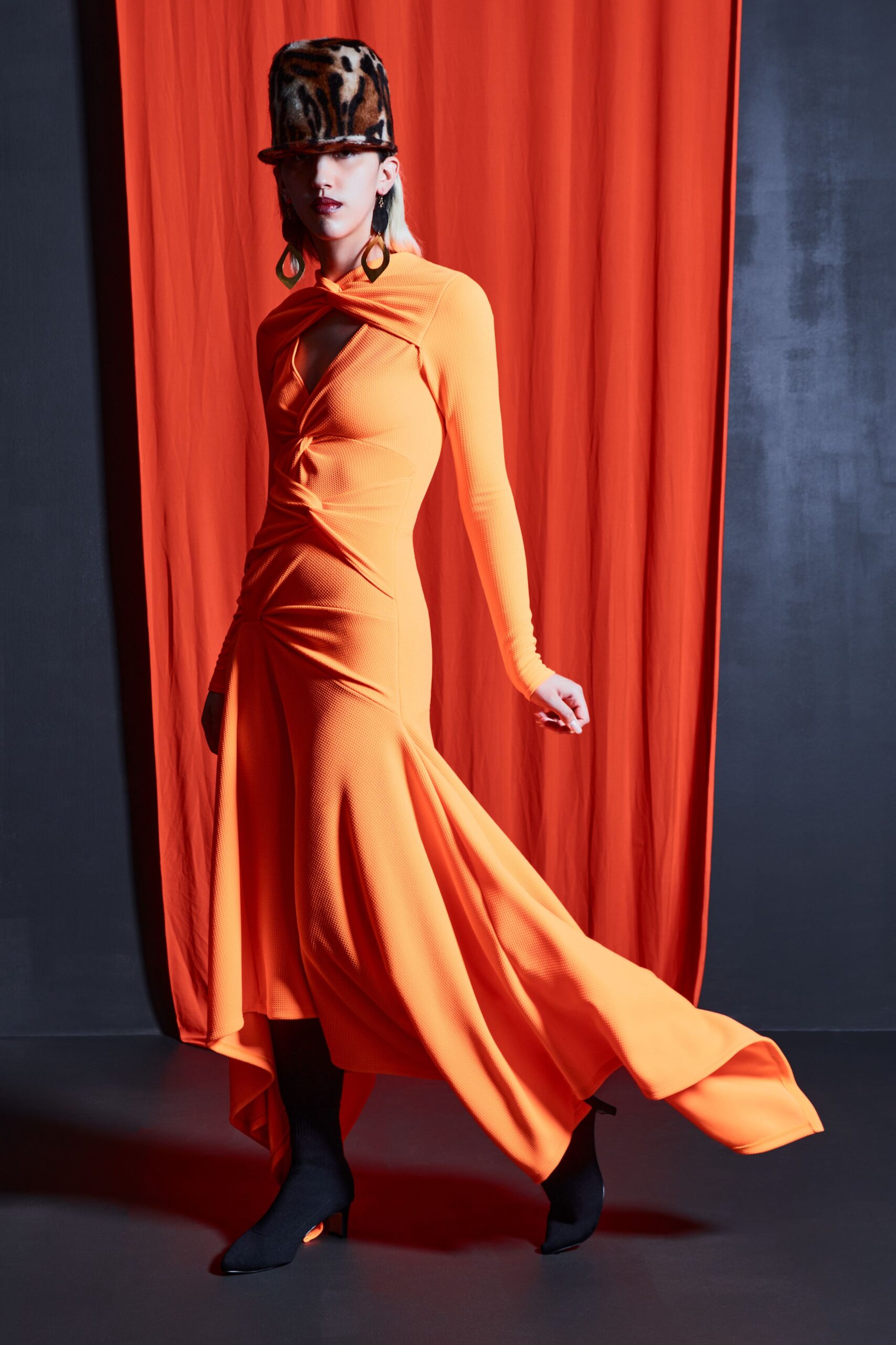 orange jersey long-sleeve v-neck fitted ruched flowing dress