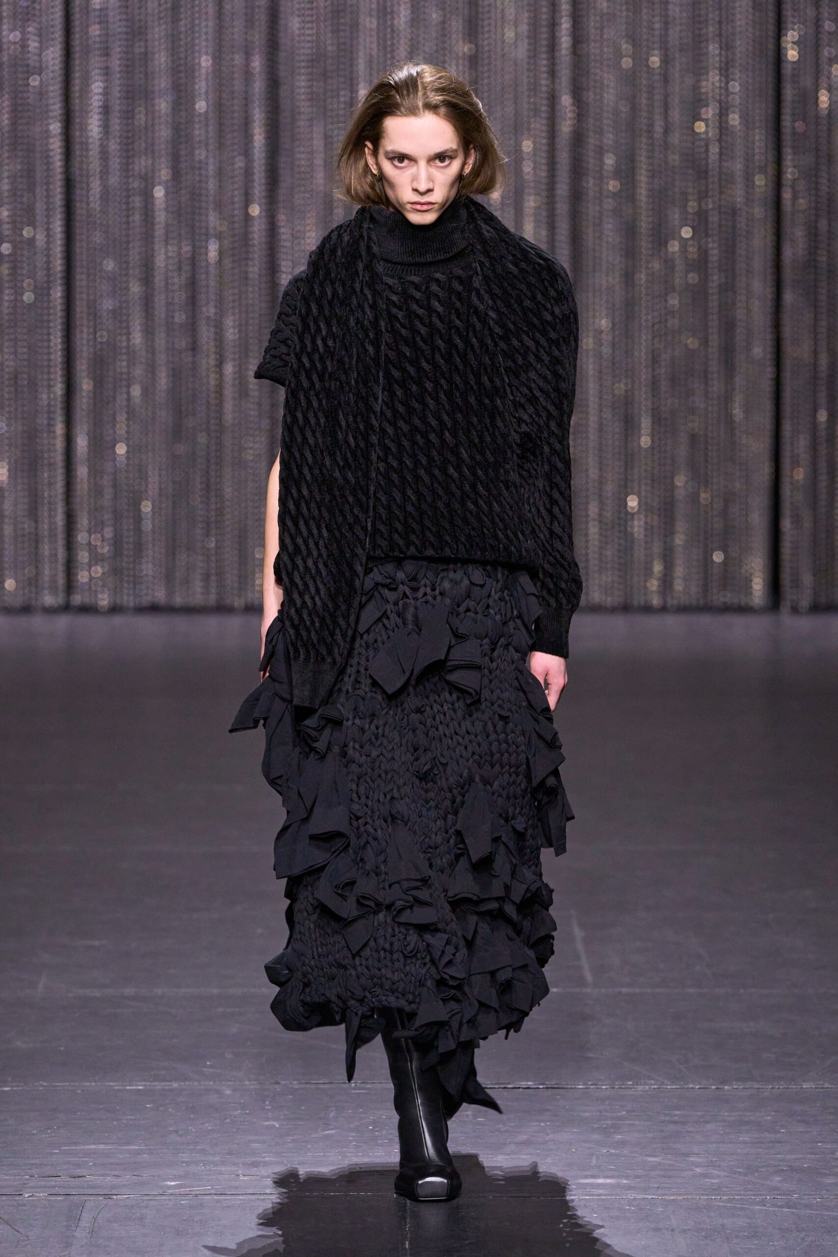 black knitted top and ruffled skirt