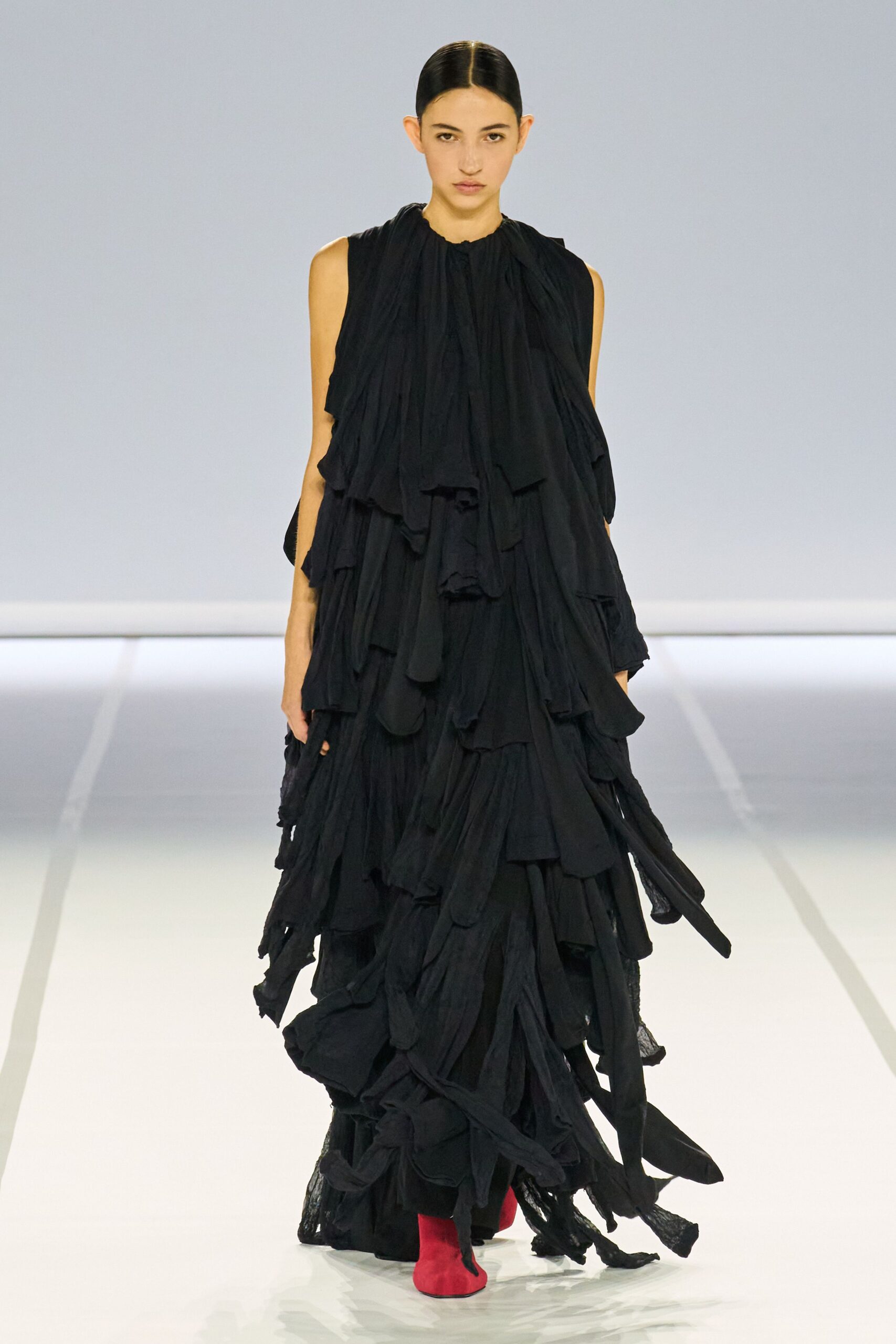 black ruffled maxi dress with red shoes
