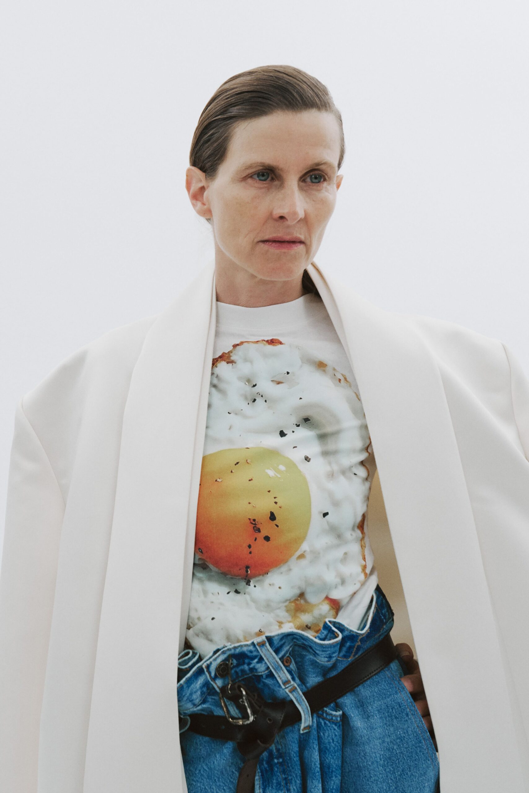 white oversized coat with printed shirt
