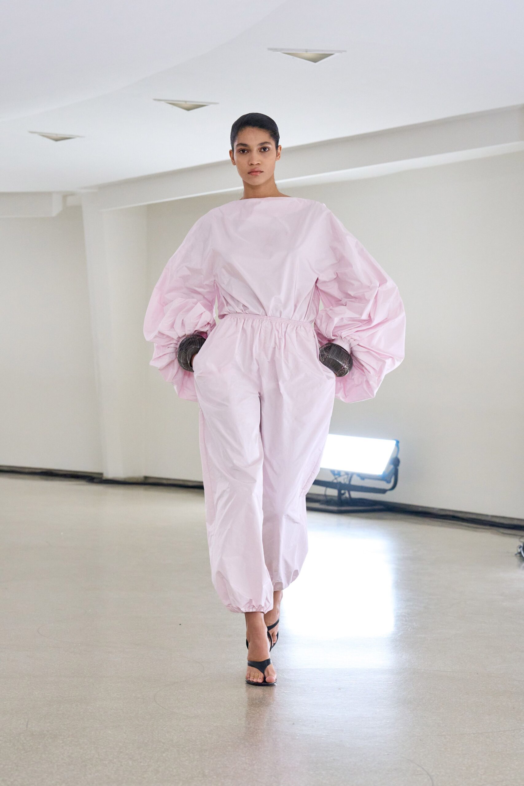 pink cotton long-sleeve collared relaxed pleated zippered jumpsuit