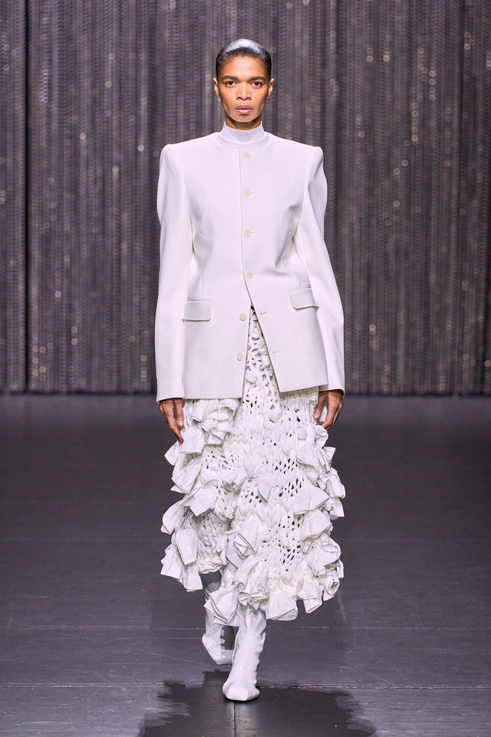 white structured blazer and ruffled dress