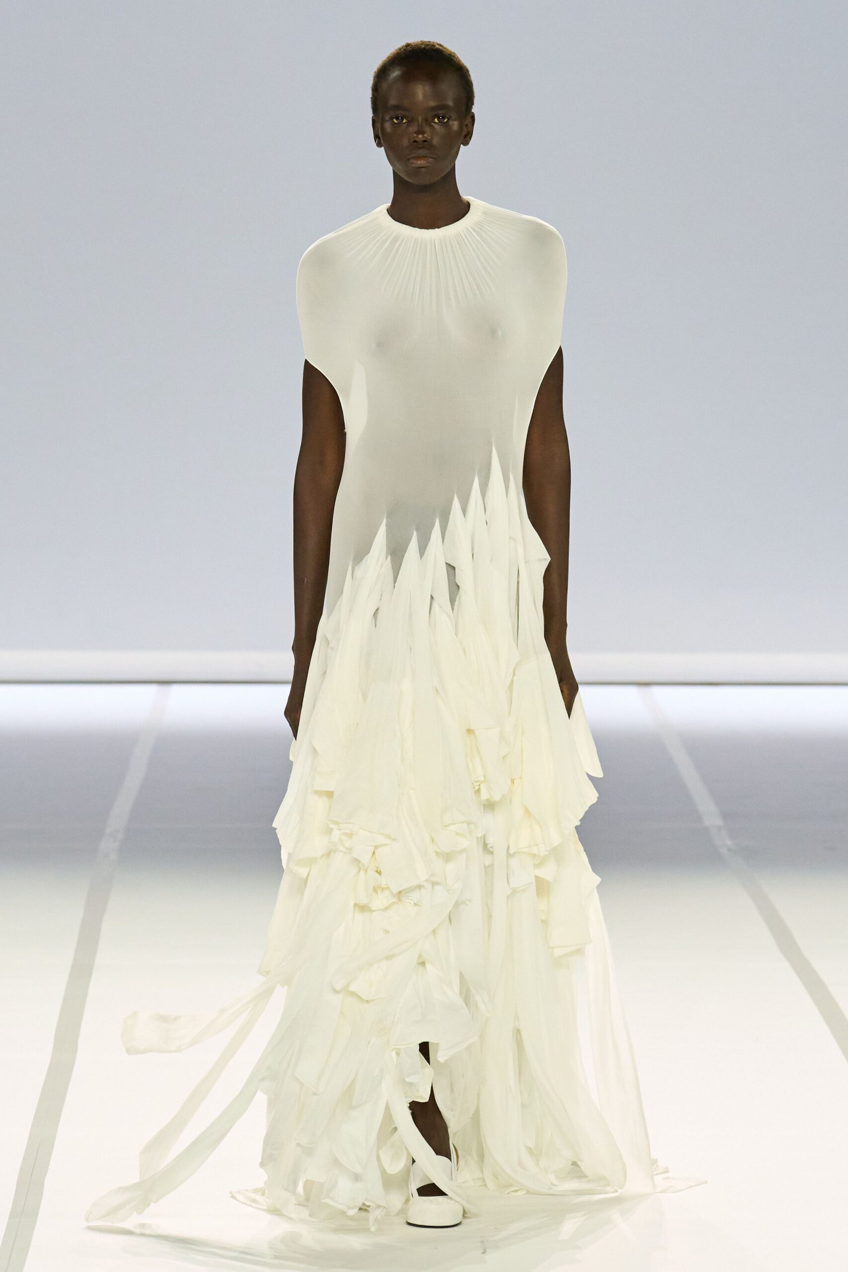 white flowing gown with draped details